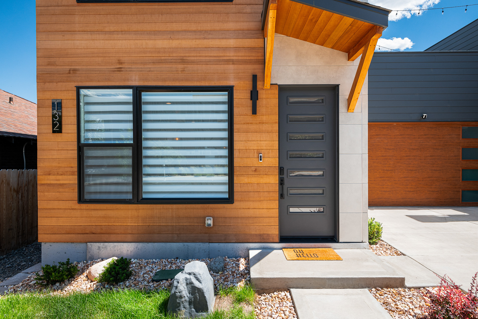 Close-up real estate photography of ultra-modern front entrance and custom door design in Temecula city home - Andrew Crippen Visuals
