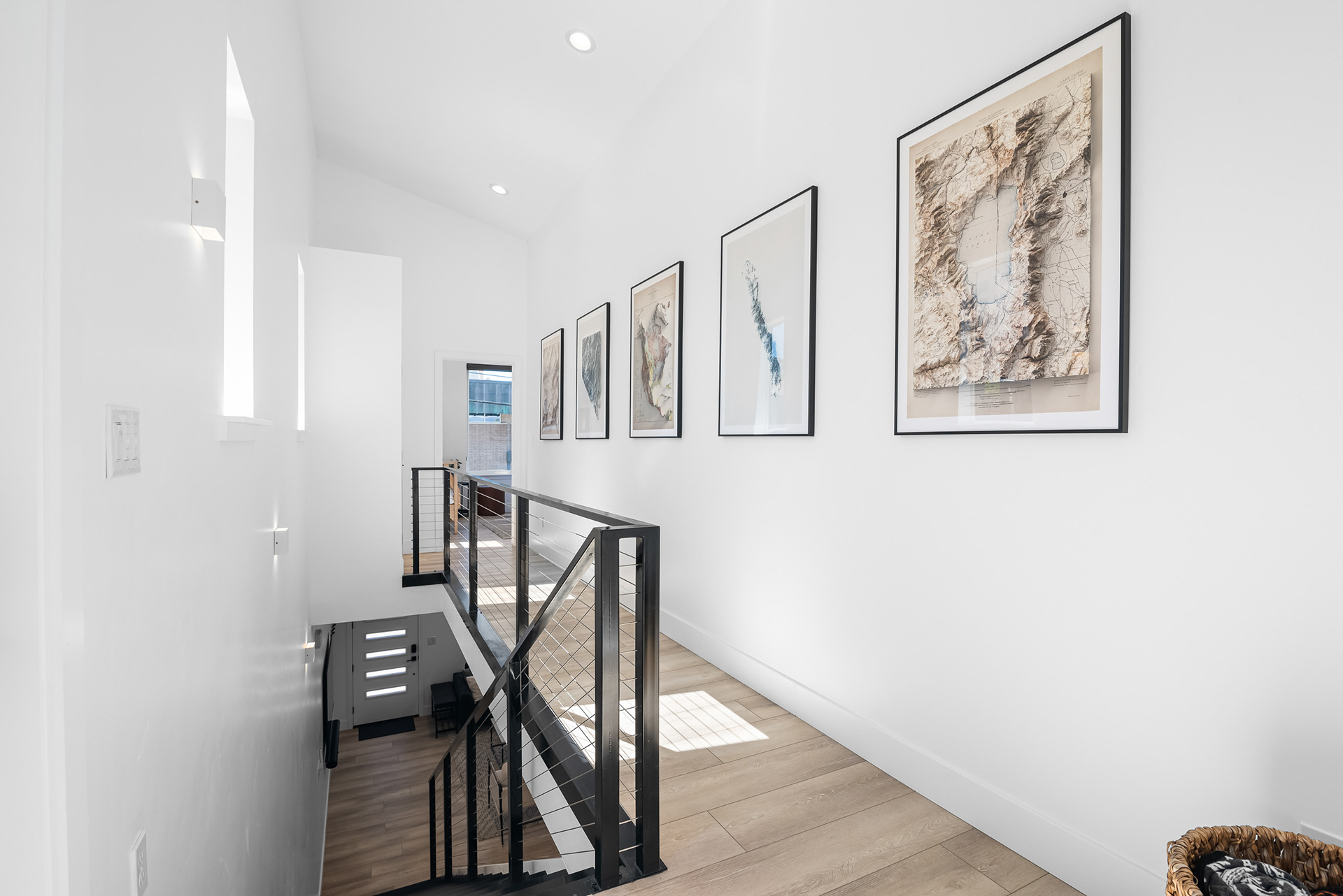 Interior real estate photography capturing natural light patterns and modern cable railing at the top of the staircase in Temecula city home - Andrew Crippen Visuals