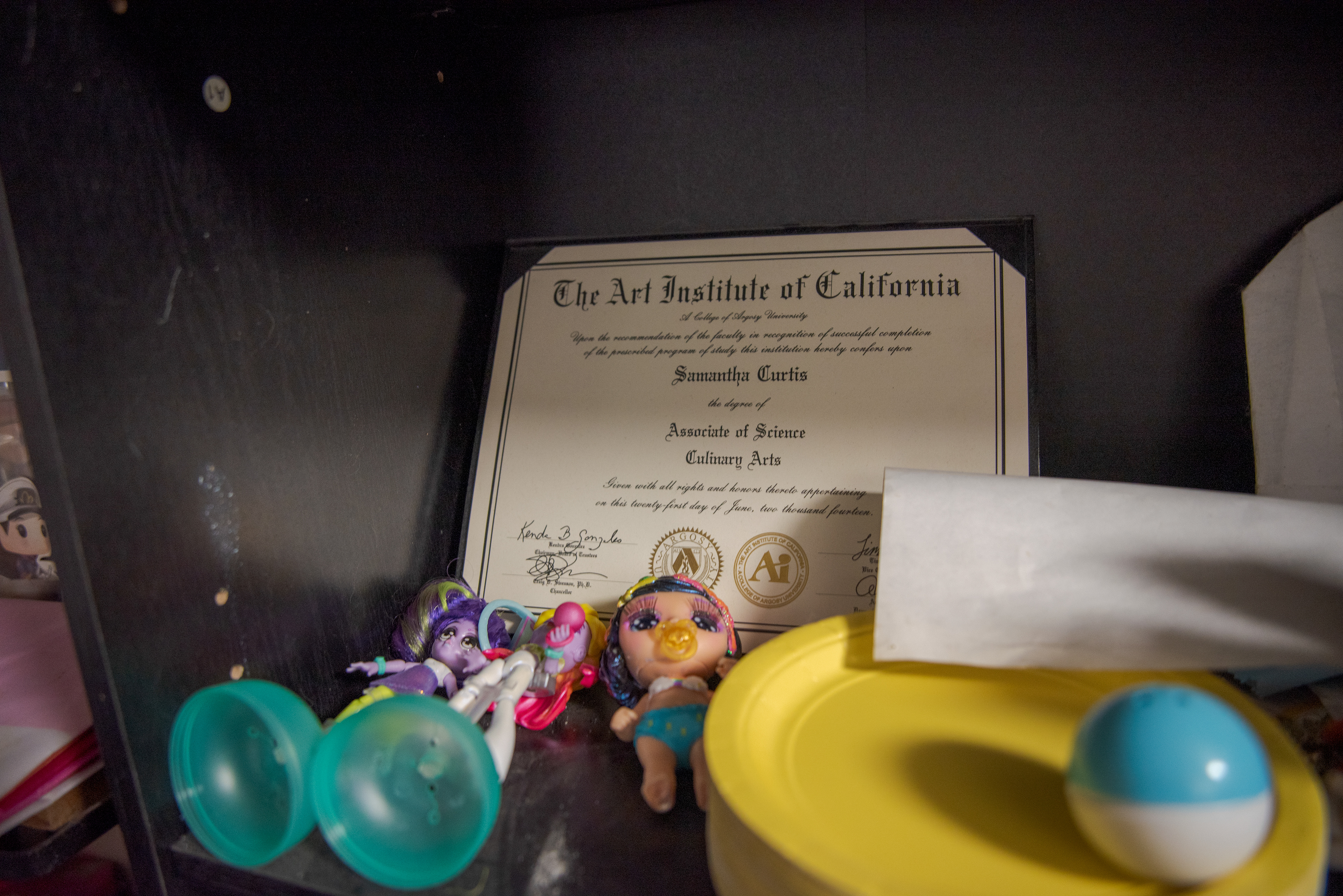 Samantha Bourgeois' culinary degree sits on their shelf in their apartment in Sacramento, Calif. on Sept.11, 2020. Bourgeois says that they are passionate about cooking and found it difficult for them when they lost their job as a baker. 