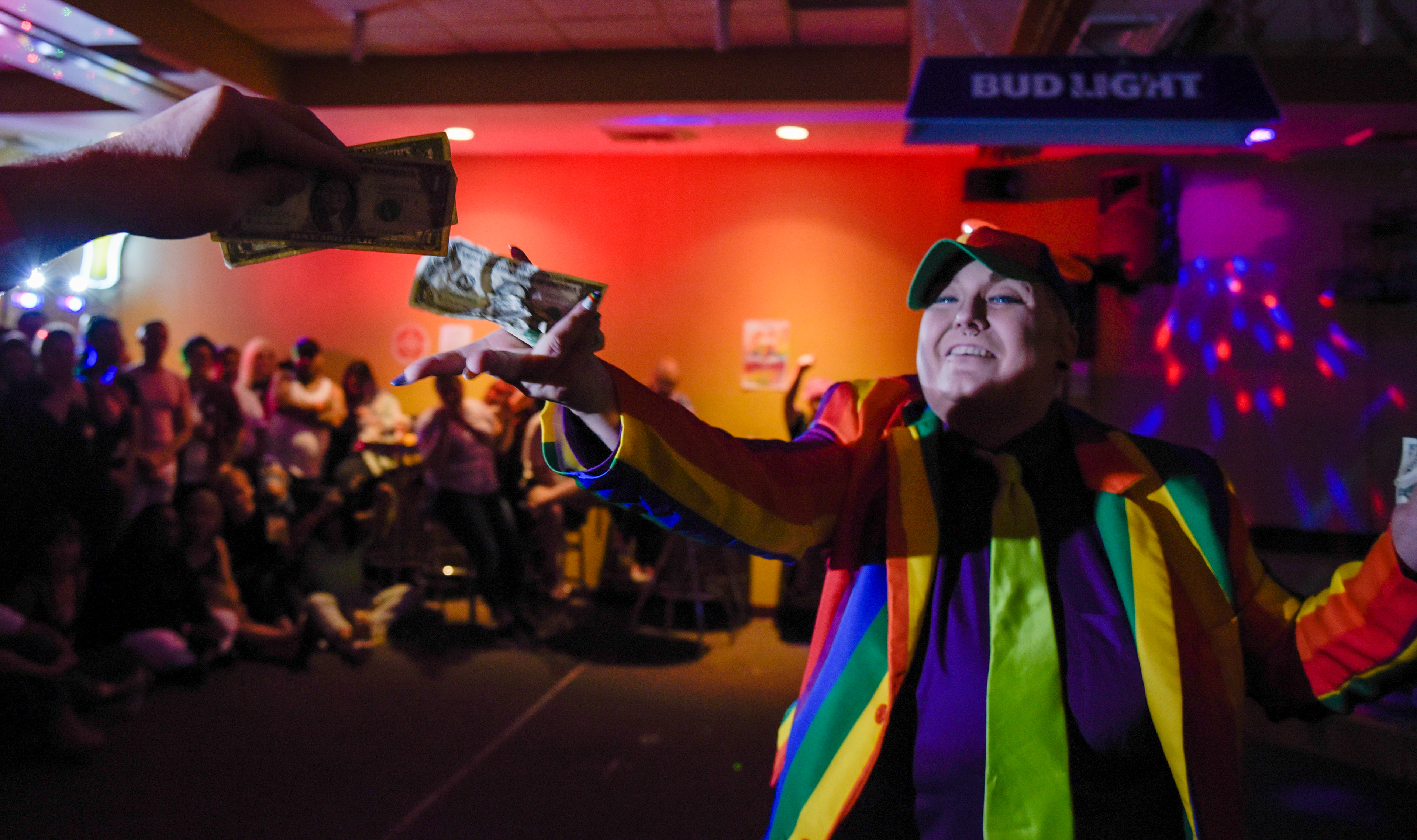  Samantha Bourgeois performs as their drag persona, Lez-he West, and lip syncs to Pharrell Williams’ “Happy” as they grab tips from the crowd at Pride Ball in the Hide-A Way Lounge & Grill in Vacaville, Calif. on June 26, 2021.