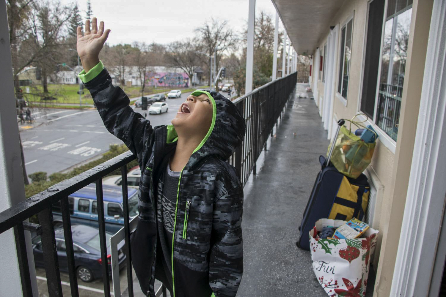 Gavin waits outside their motel room as his mother packs the rest of their belongings on Jan. 5, 2019.