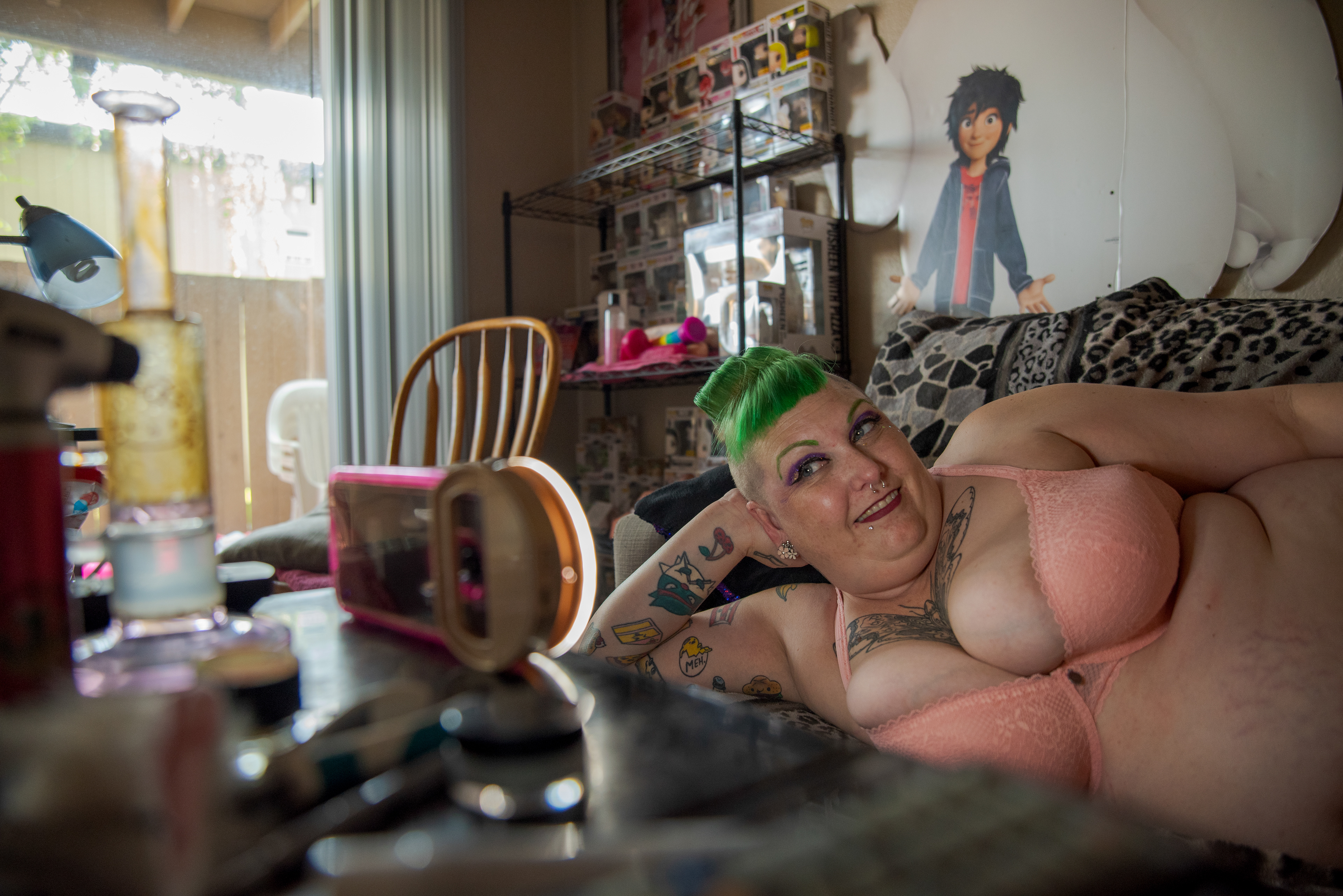 Samantha Bourgeois takes photos in their Sacramento apartment on Sept. 4, 2020 to post on OnlyFans, a content subscription service specializing in explicit content.  Bourgeois lost their baking job at Odd Cookie Bakery in March 2020 due to the COVID-19 and has been using the platform to make extra money. 