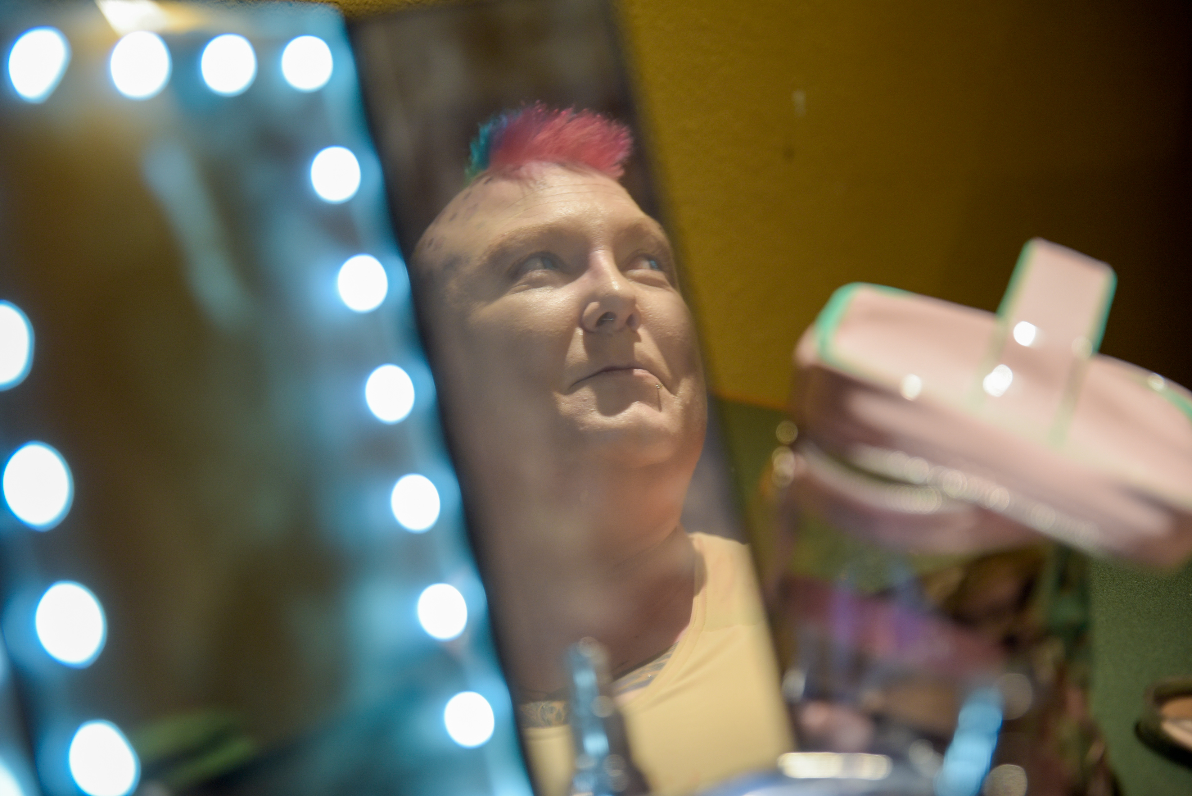 Samantha Bourgeois transforms themselves into their drag king persona, Lez-he West, to perform at Pride Ball in the Hide-A Way Lounge & Grill in Vacaville, Calif. on June 26, 2021