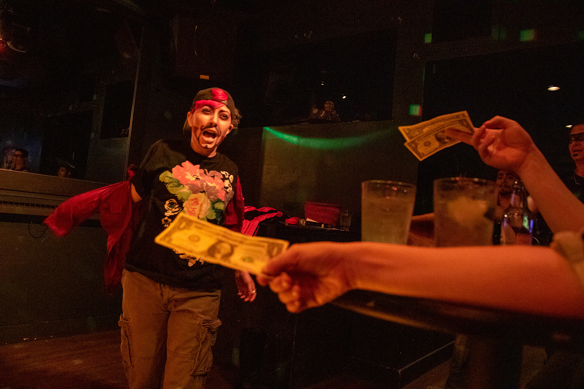 Victoria Augusto performs as their drag persona, Sir Vix, as audience members tip them during Kings’ Night Out, a monthly drag king show, at Sidetrax in Sacramento, Calif. on Nov. 7, 2019. 