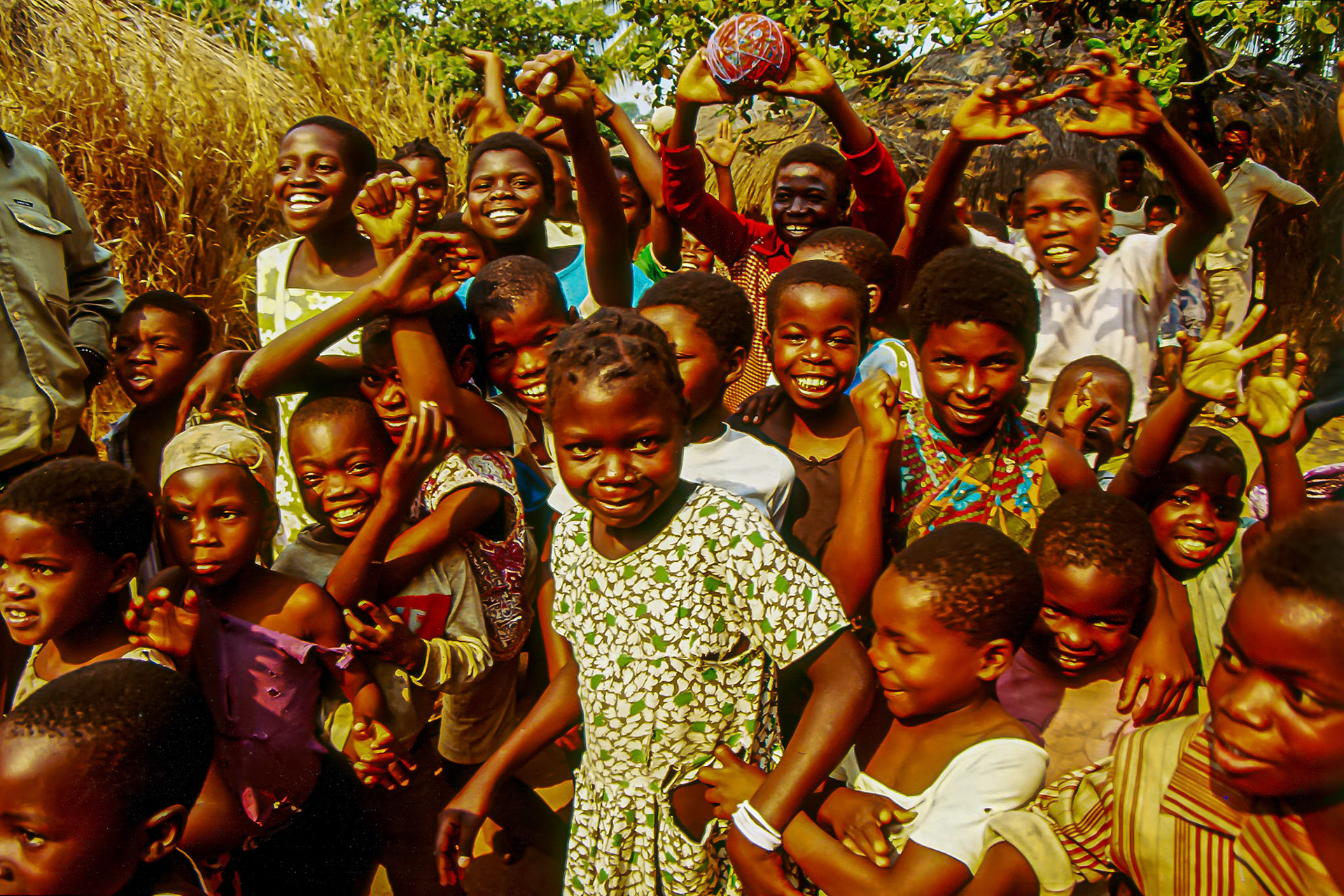 Children crowding the photographer • Mozambique