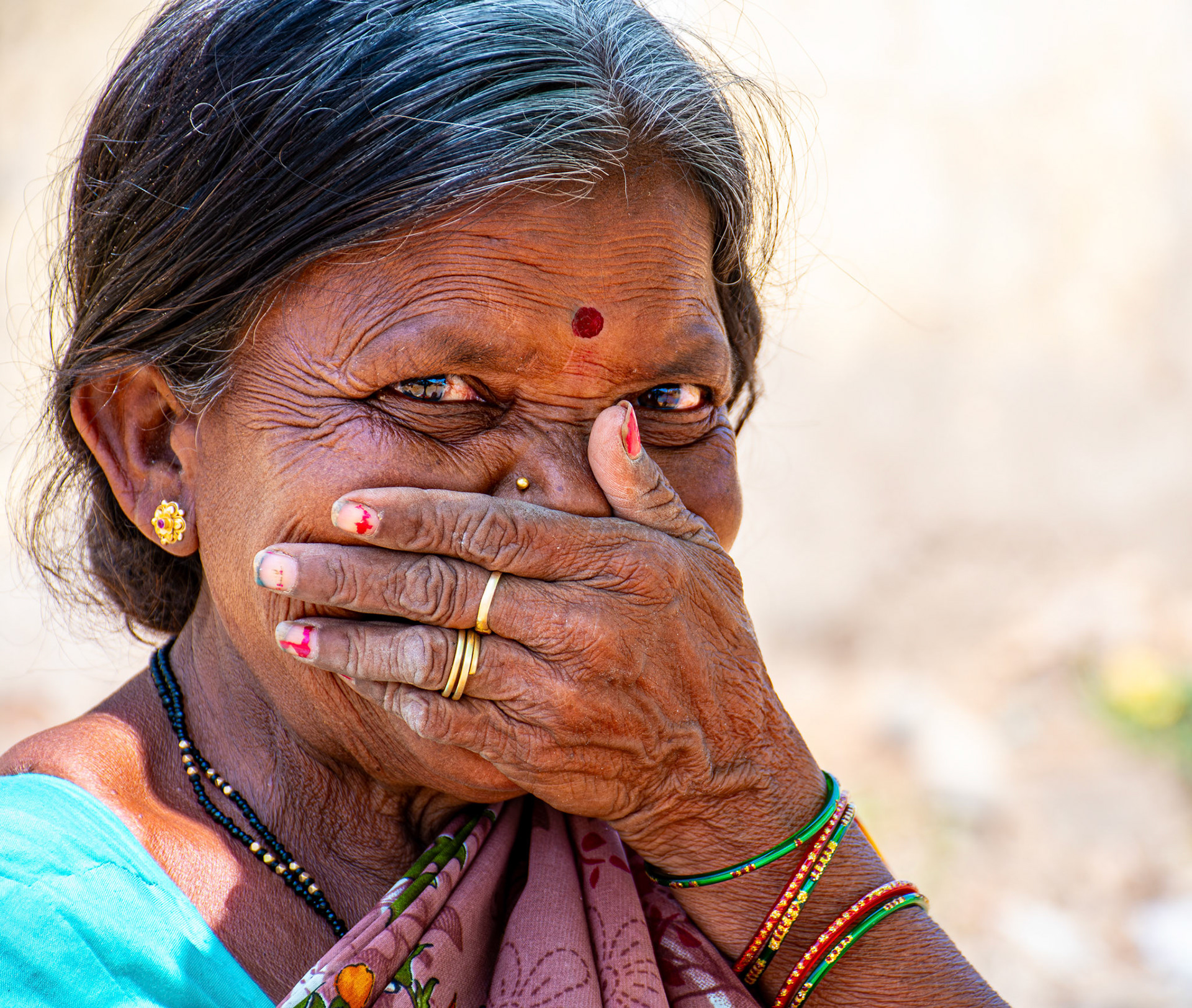 Woman hiding her smile • India