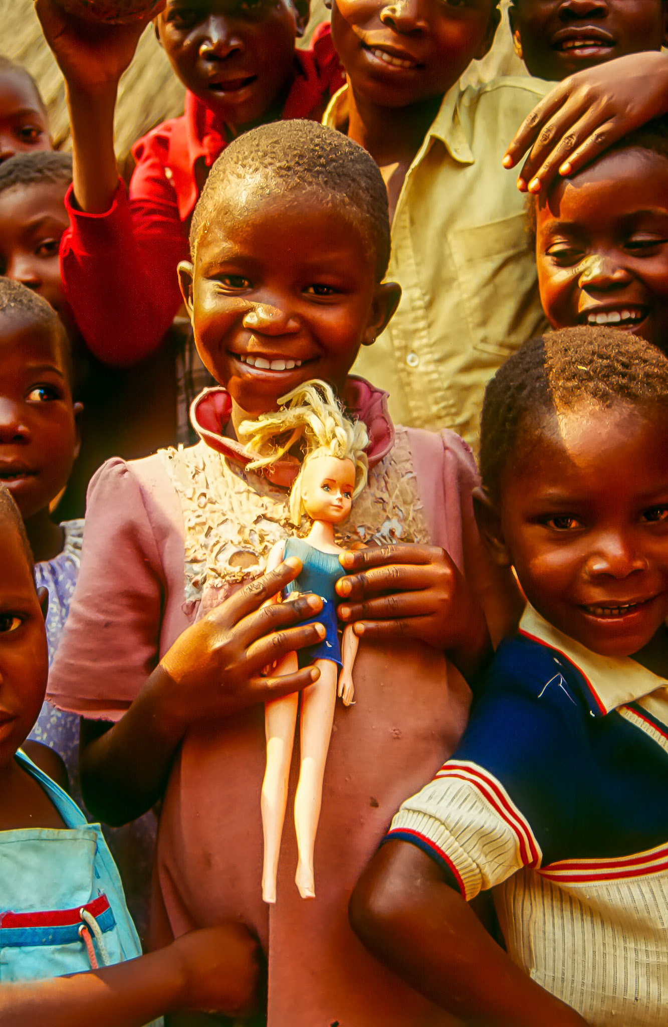 Girl with doll • Mozambique