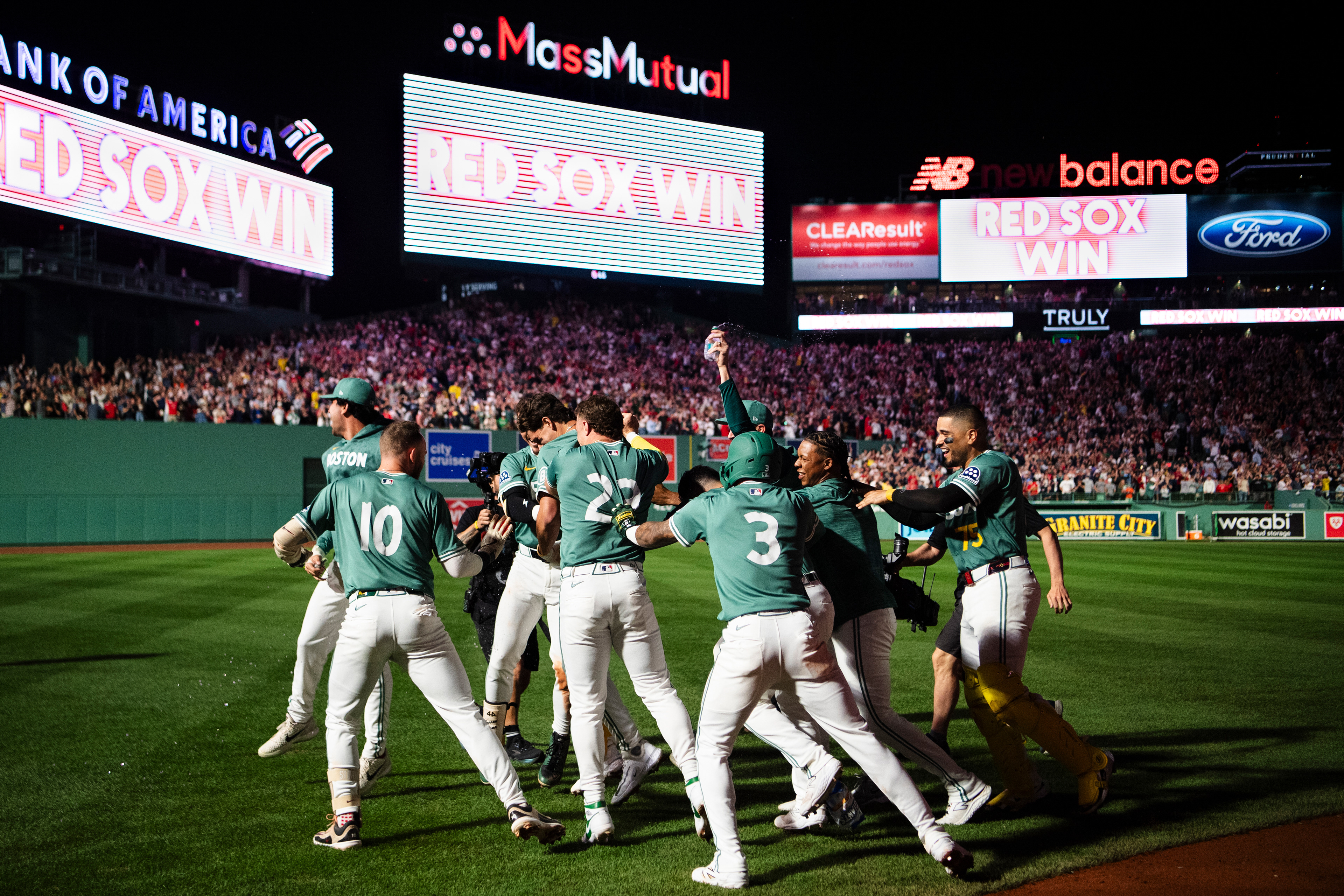 August 1, 2025, Boston, MA: Trevor Story #10 of the Boston Red Sox, Marcelo Mayer #39 of the Boston Red Sox, Romy Gonzalez #23 of the Boston Red Sox, Connor Wong #12 of the Boston Red Sox, Carlos Narvaez #75 of the Boston Red Sox, and Ceddanne Rafaela #3 of the Boston Red Sox mob Roman Anthony #19 of the Boston Red Sox after he hit his first career walk off single against the Houston Astros at Fenway Park in Boston, Massachusetts Friday, August 1, 2025.  (Photo by Clay Stark/Boston Red Sox)