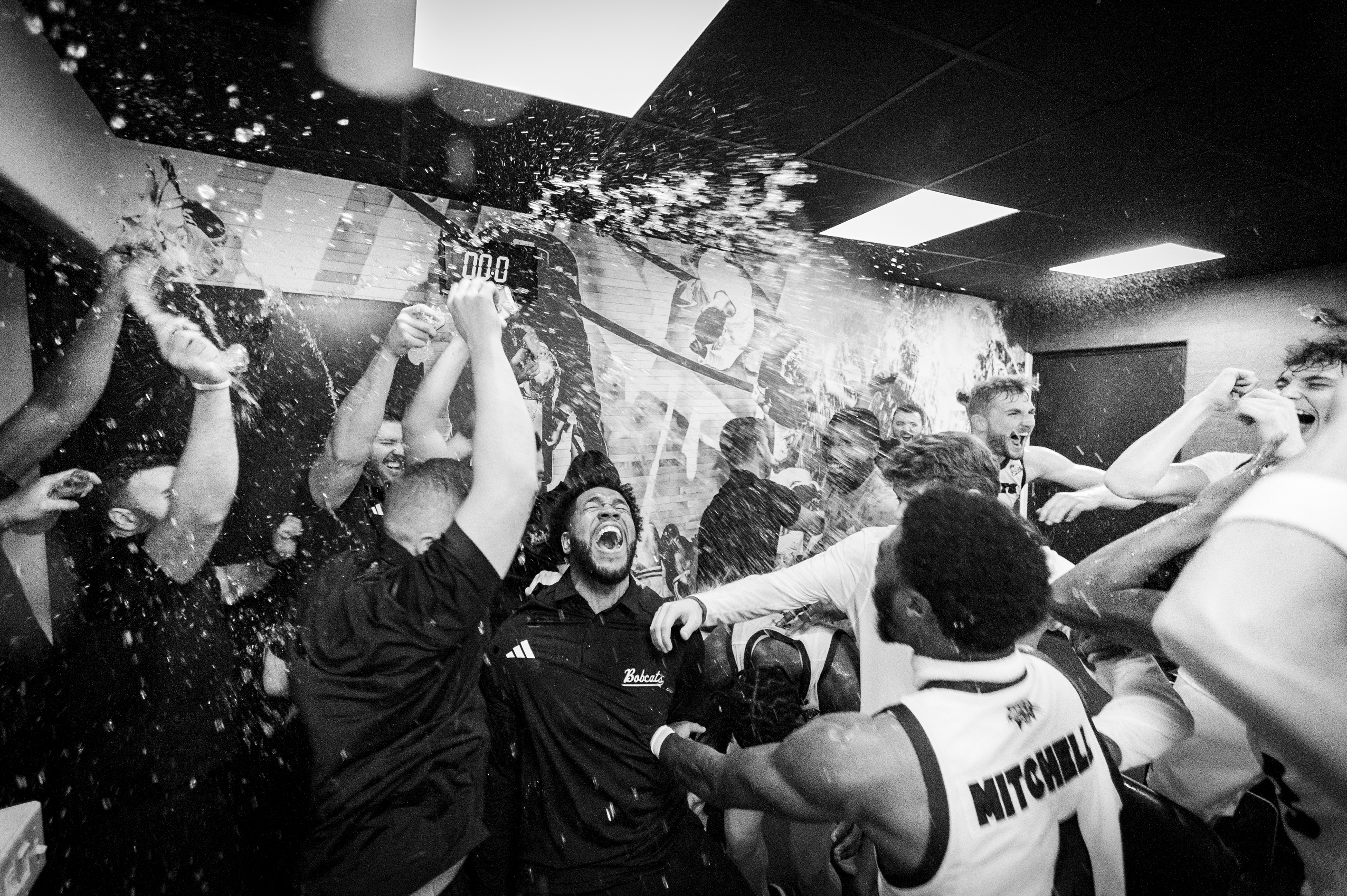 December 2, 2023, Athens, Ohio: Ohio University men’s basketball team celebrates a comeback win over the University of Delaware at the Convocation Center. (Photo by Clay Stark)
