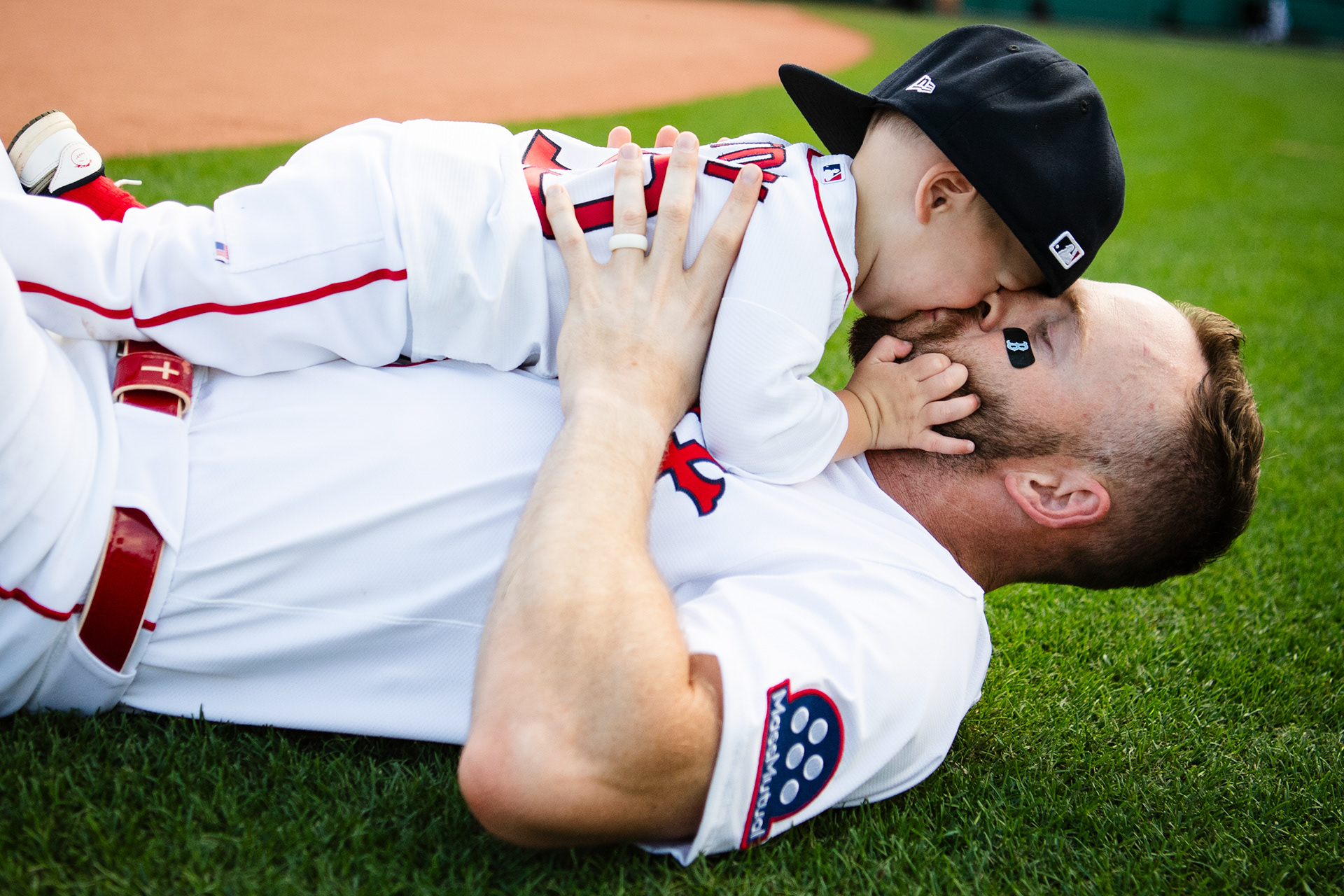 June 29, 2025, Boston, MA: Trevor Story #10 of the Boston Red Sox kisses his son during Family Day at Fenway Park in Boston, Massachusetts Sunday, June 29, 2025.  (Photo by Clay Stark/Boston Red Sox)