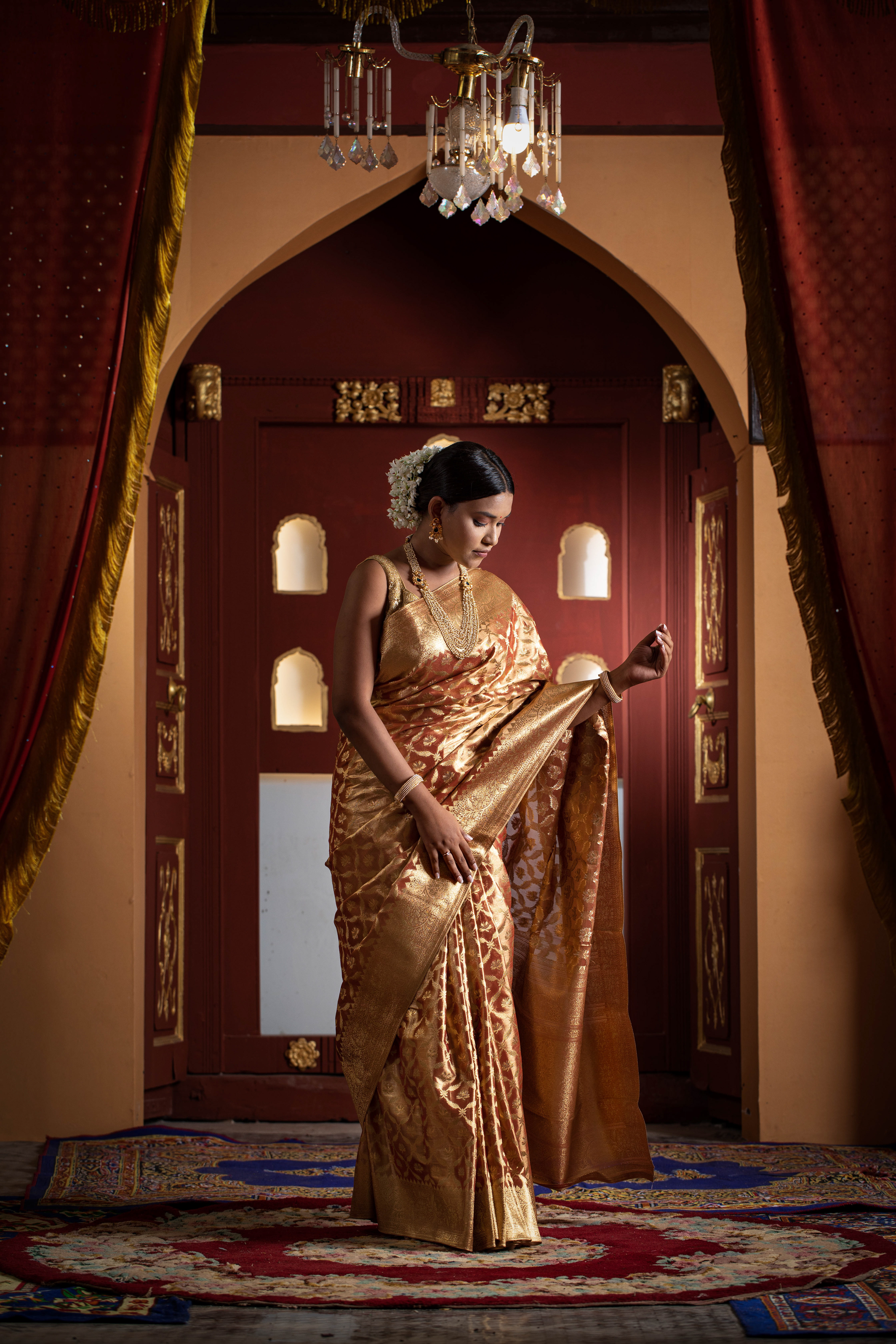 Authentic traditional fashion portrait of a woman in an embroidered silk saree  in warm festival lighting-Fashion-Photography-Pune-Mumbai
