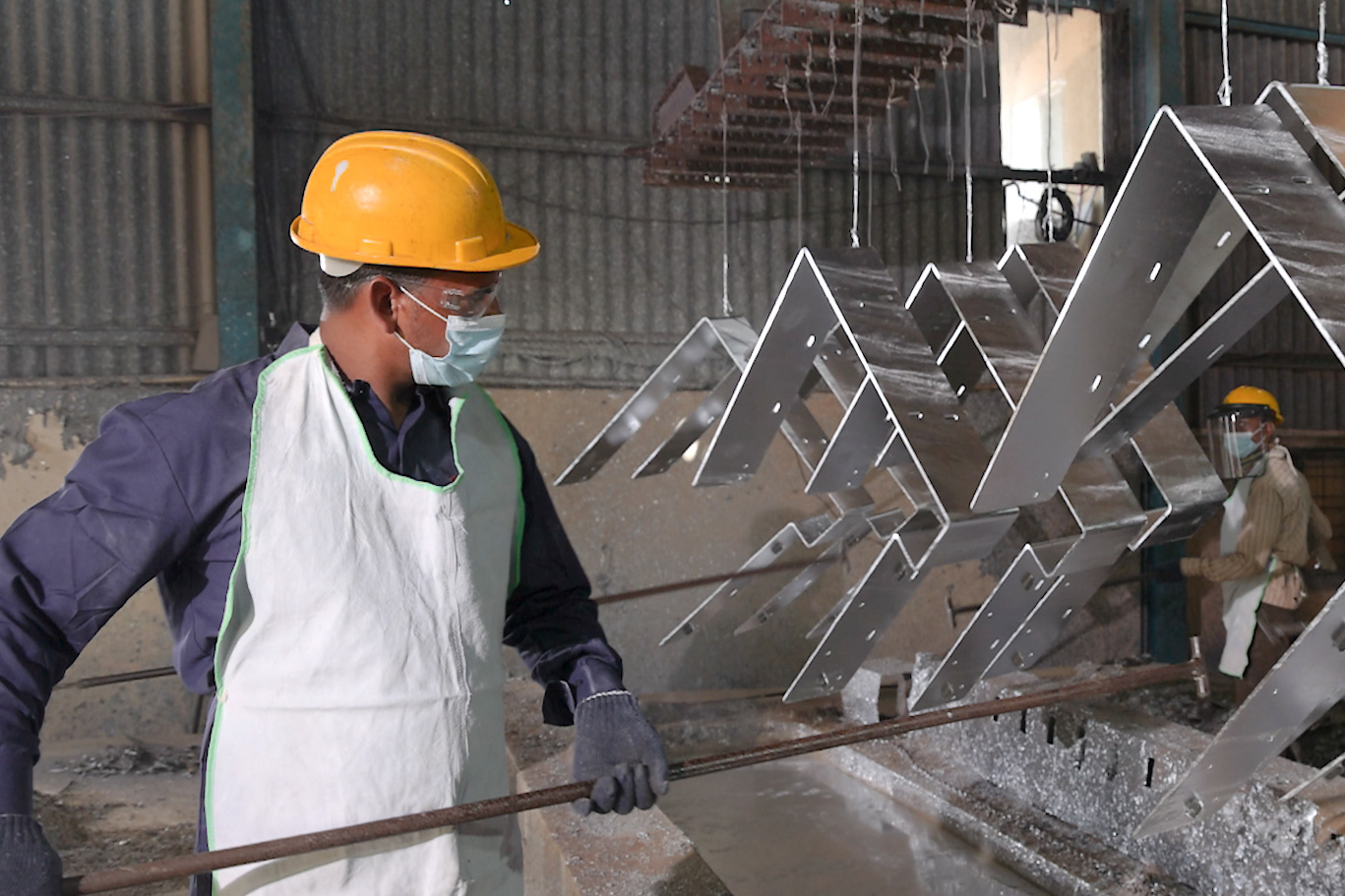 Industrial photography of professionals working in a manufacturing facility in Pune and Mumbai