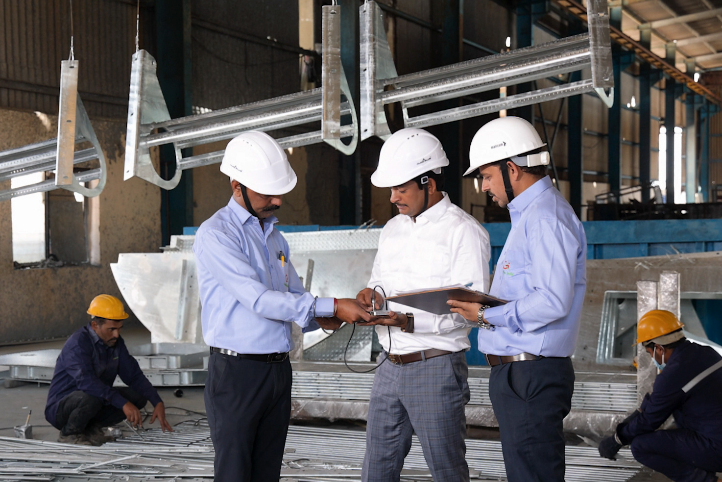 Industrial photography of professionals working in a manufacturing facility in Pune and Mumbai