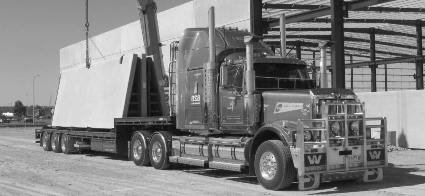 transporting large concrete panels on a truck