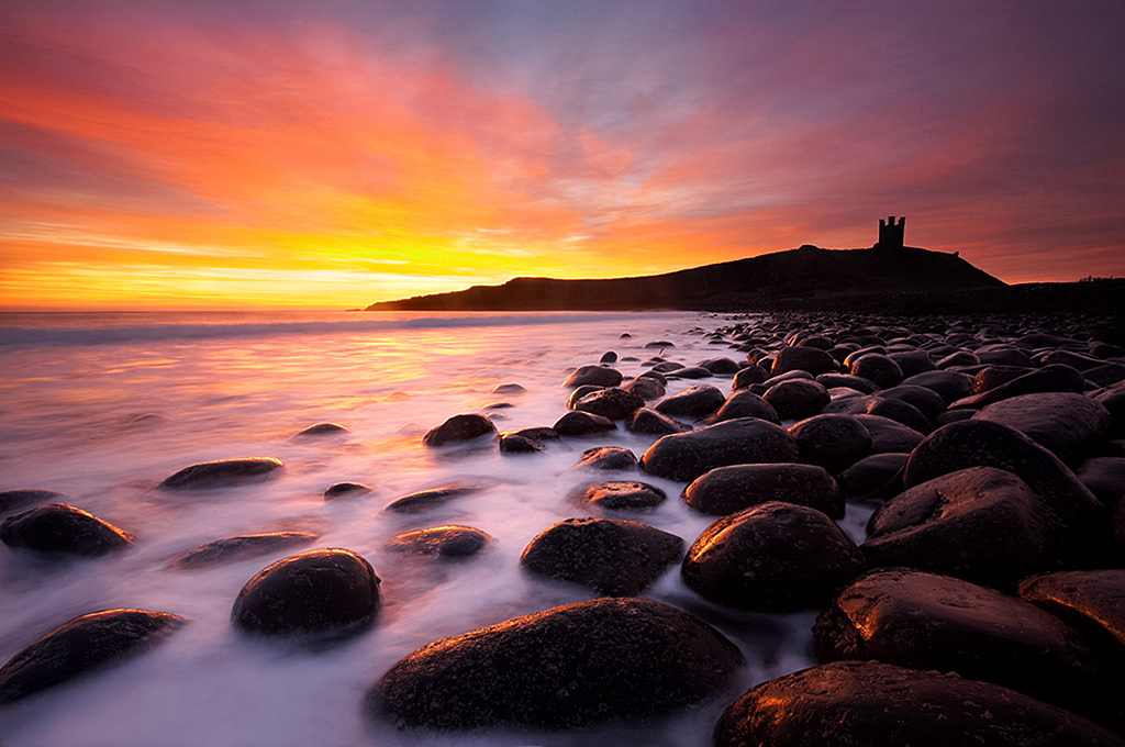 Sunrise over Dunstanburgh Castle, Northumberland
