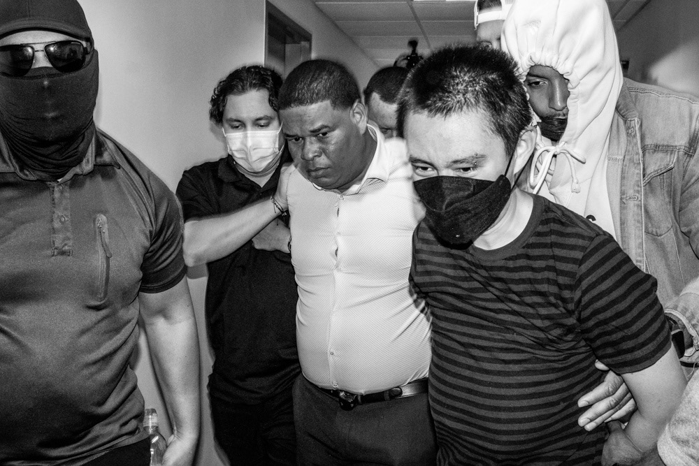 A respondent is detained along with a legal observer after a scuffle involving federal agents.