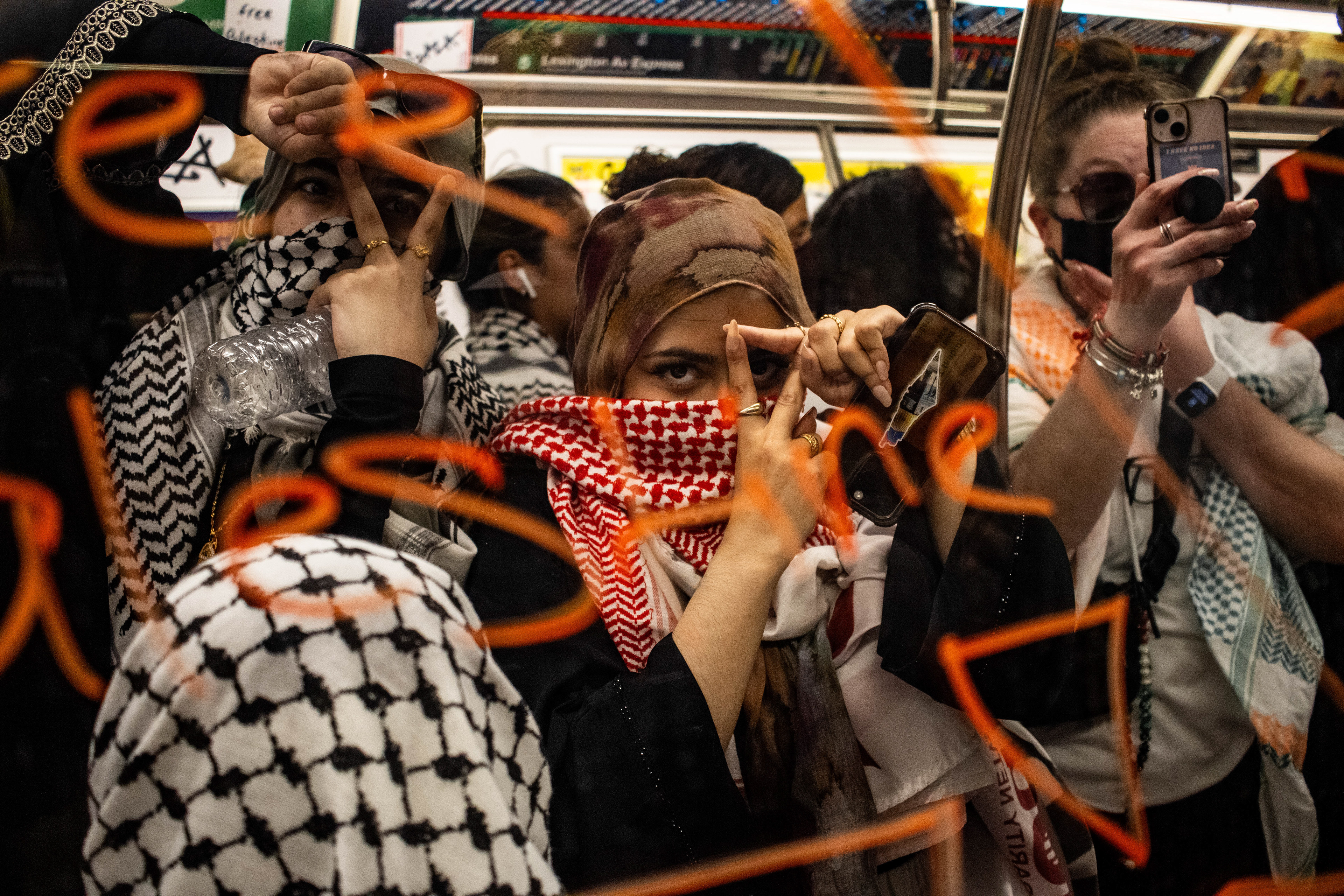 Pro Palestine Protestors hop on the subway leaving graffiti behind in New York, New York on June 10th, 2024.