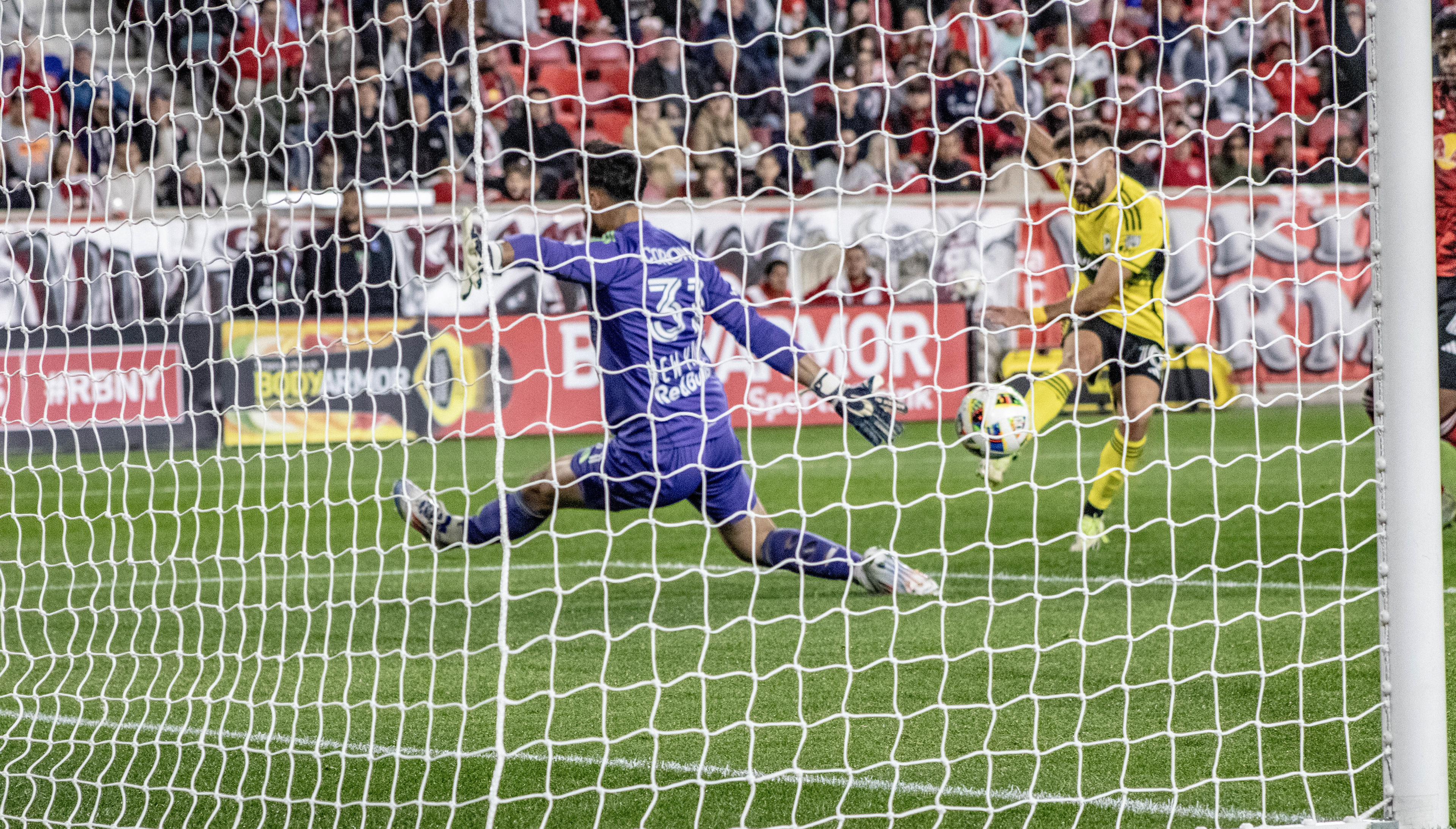 Carlos Coronel of the New York Red Bulls outstretches his body to save a shot on goal versus the Columbus Crew on November 3rd, 2024.