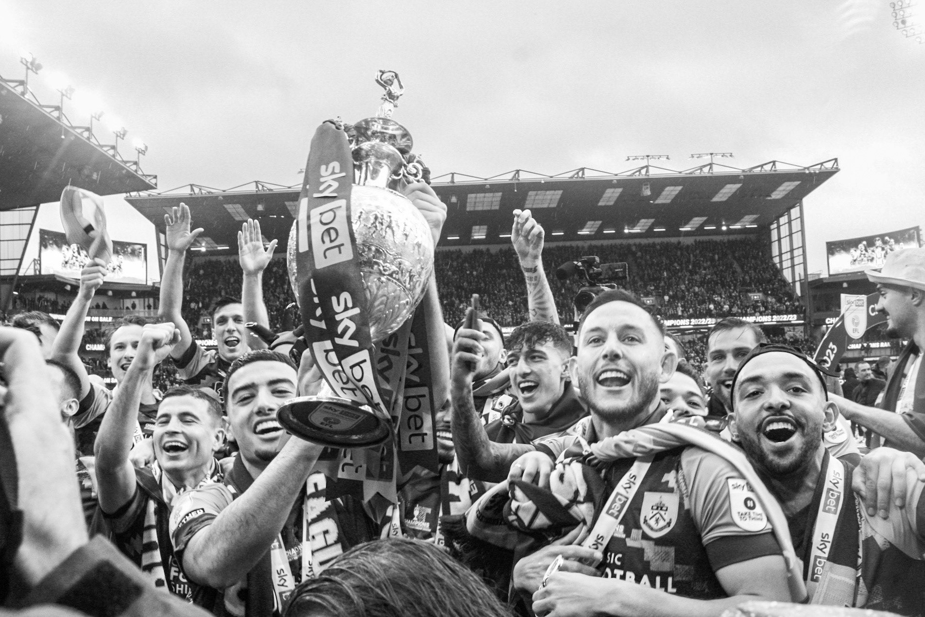 Burnley F.C. players celebrate their EFL Championship win and promotion to the Premier League on the last day of the season in Turf Moore, Burnley on May 8th, 2023.