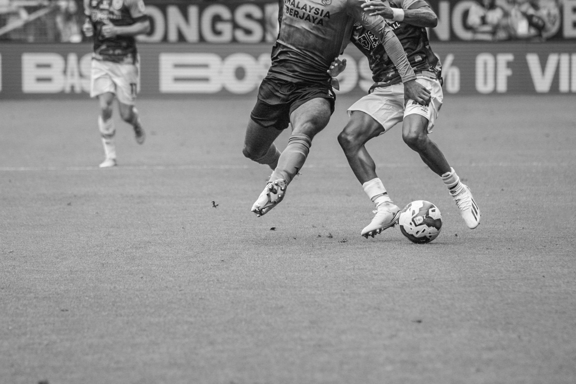 Burnley F.C. and Cardiff F.C. players fight for the ball in Turf Moore, Burnley on May 8th, 2023.