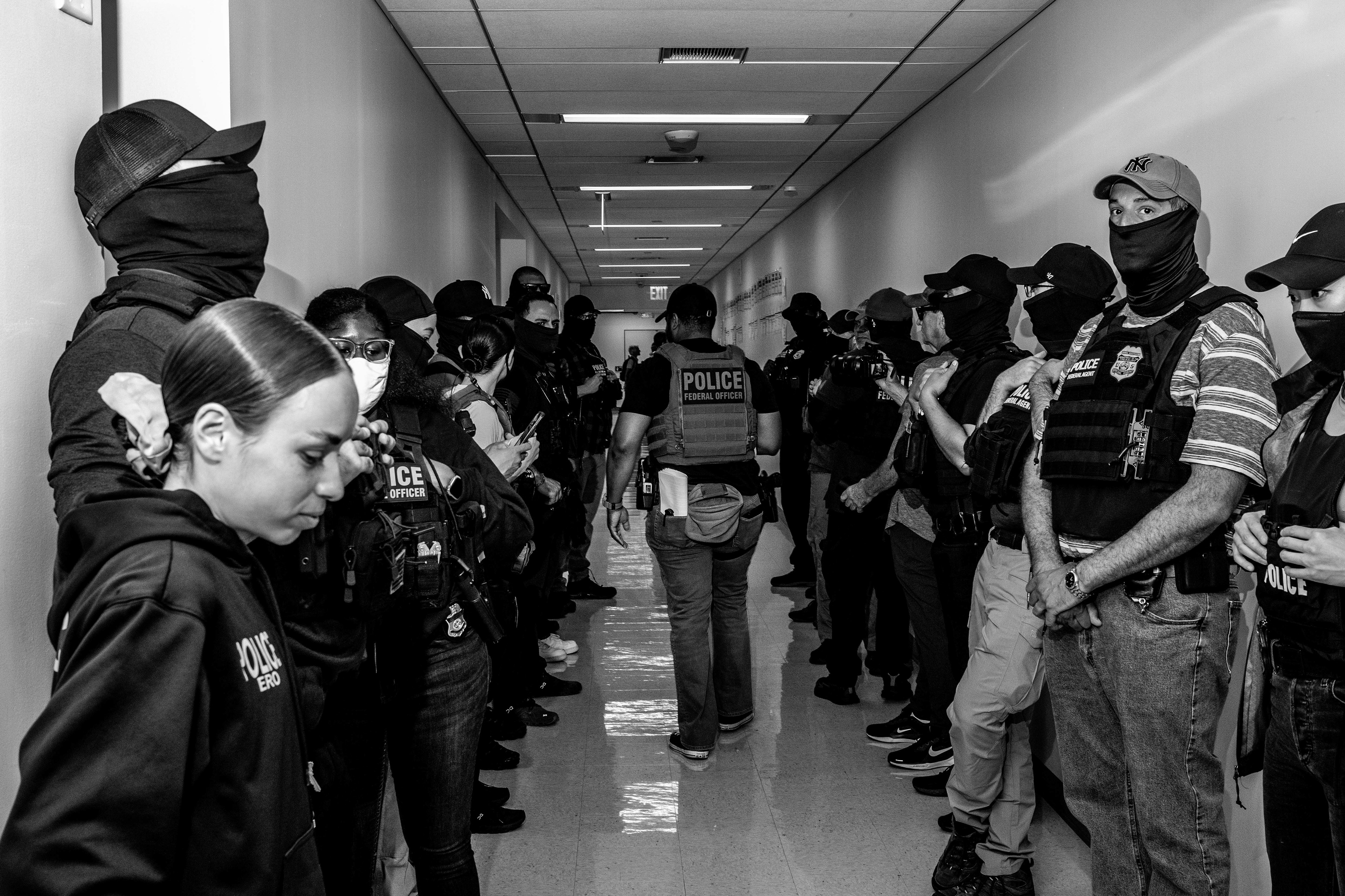 Federal agents line the hallways early on in their operation at 26 Federal Plaza. Scenes of this nature were common at 26 Federal Plaza during the summer of 2025.