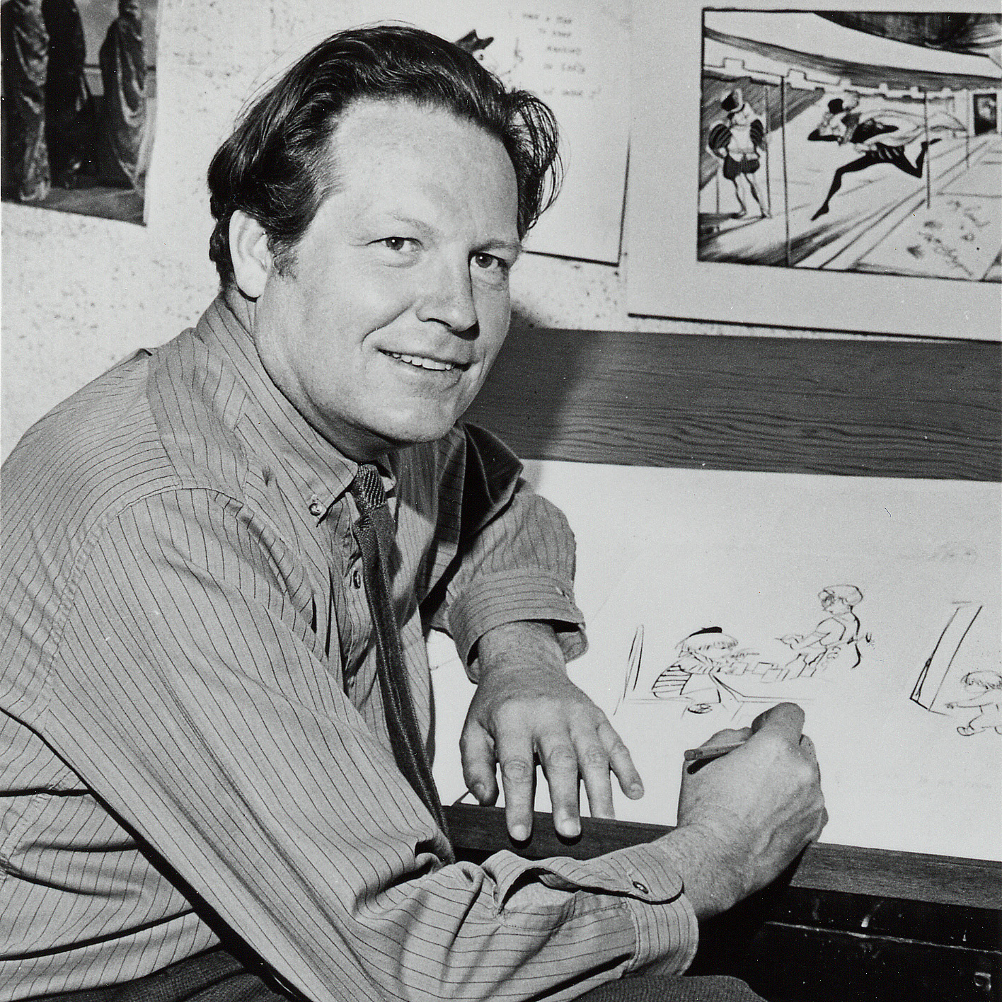 Don at his desk in 1957. His right hand is resting on an illustration for an unpublished book "Corduroy, the inferior decorator." In the upper right corner is an illustration for another unpublished book, "Great Shakes."