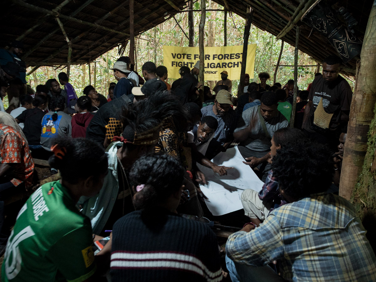 Forest Defender Camp participants learn to make maps with the NGO Bentara Papua in the Sira village forest, South Sorong Regency, Southwest Papua, September 21, 2023.