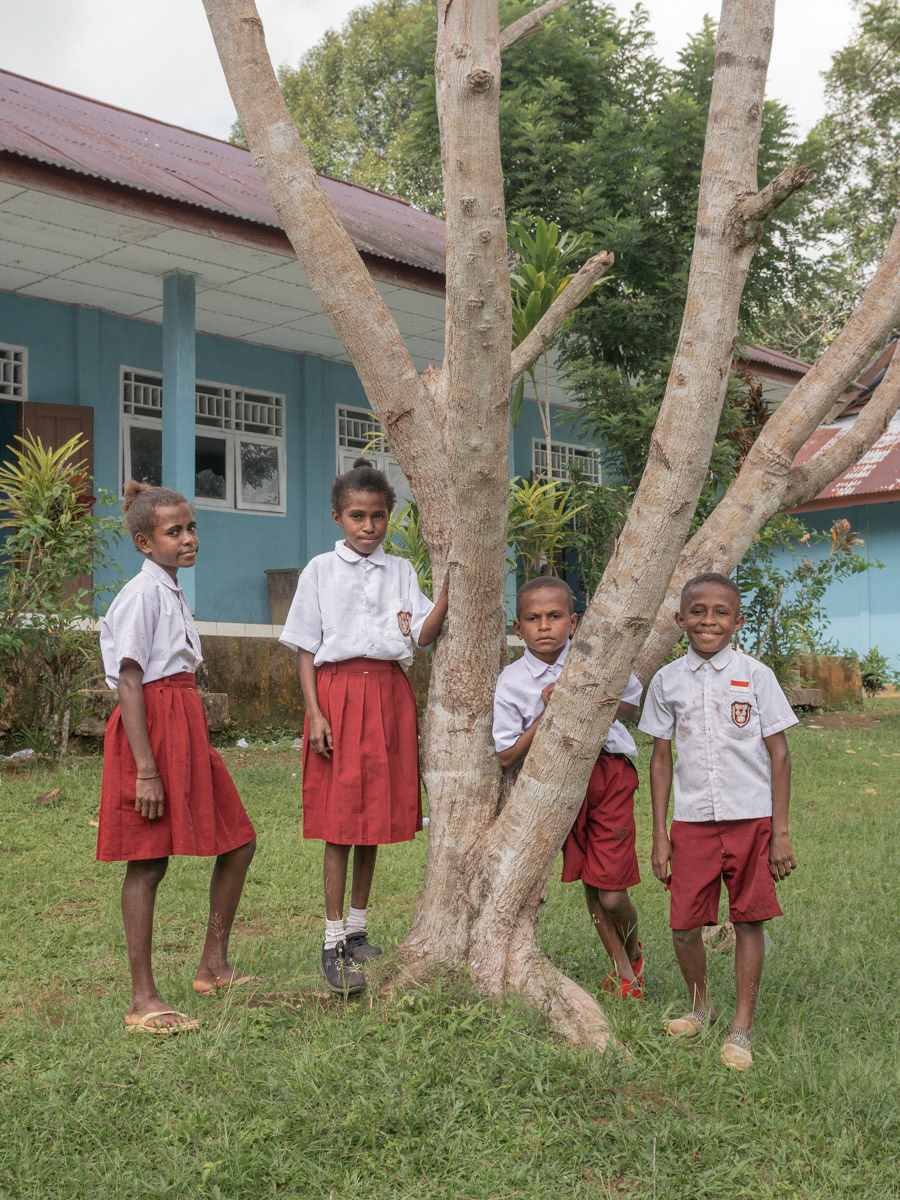 Otovina Kladit, Berselina Sremere, Alex Srefle and Hizkia Dua Srefle were photographed in front of their school in Manggroholo village, September 20, 2023. These 4 3rd grade elementary school students were waiting for their turn to study due to the limited number of teachers.