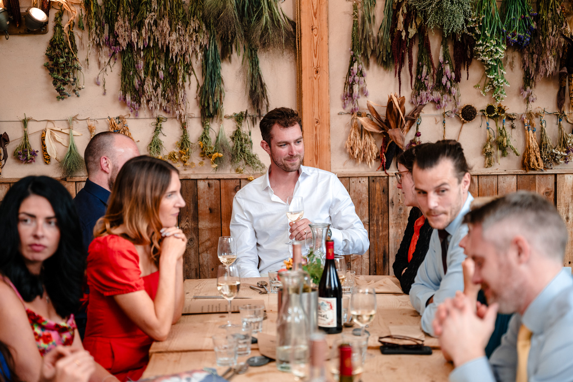 A groom drink with friends in rustic devon wedding.