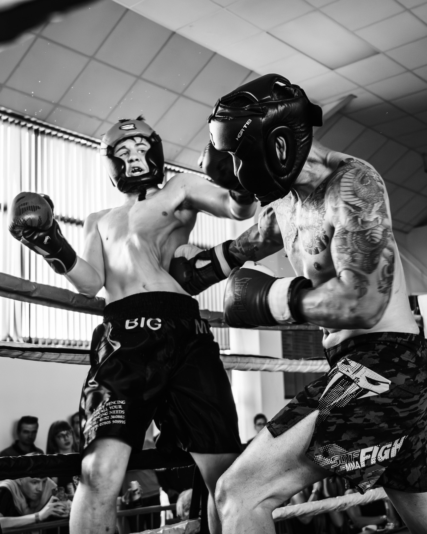 A boxer takes a devastating body shot during a Devon boxing match.