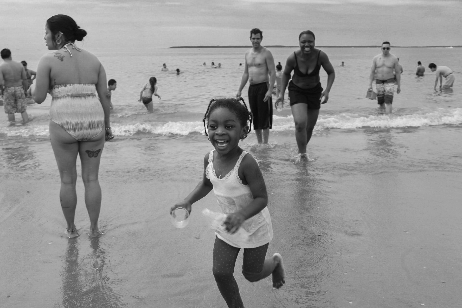 NEW YORK, NY Afiz Bamba (4) playing on the beach with her mother, Mari Bamba at Coney Island. Tuesday, July 4, 2017.