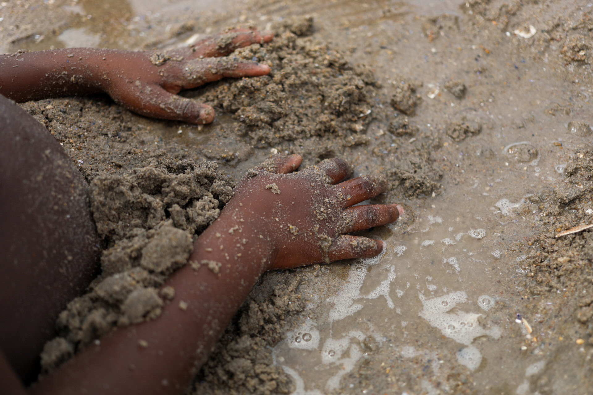 NEW YORK, NY Abdul Bamba, buries himself in the sand. Coney Island beach, Tuesday, July 4, 2017.