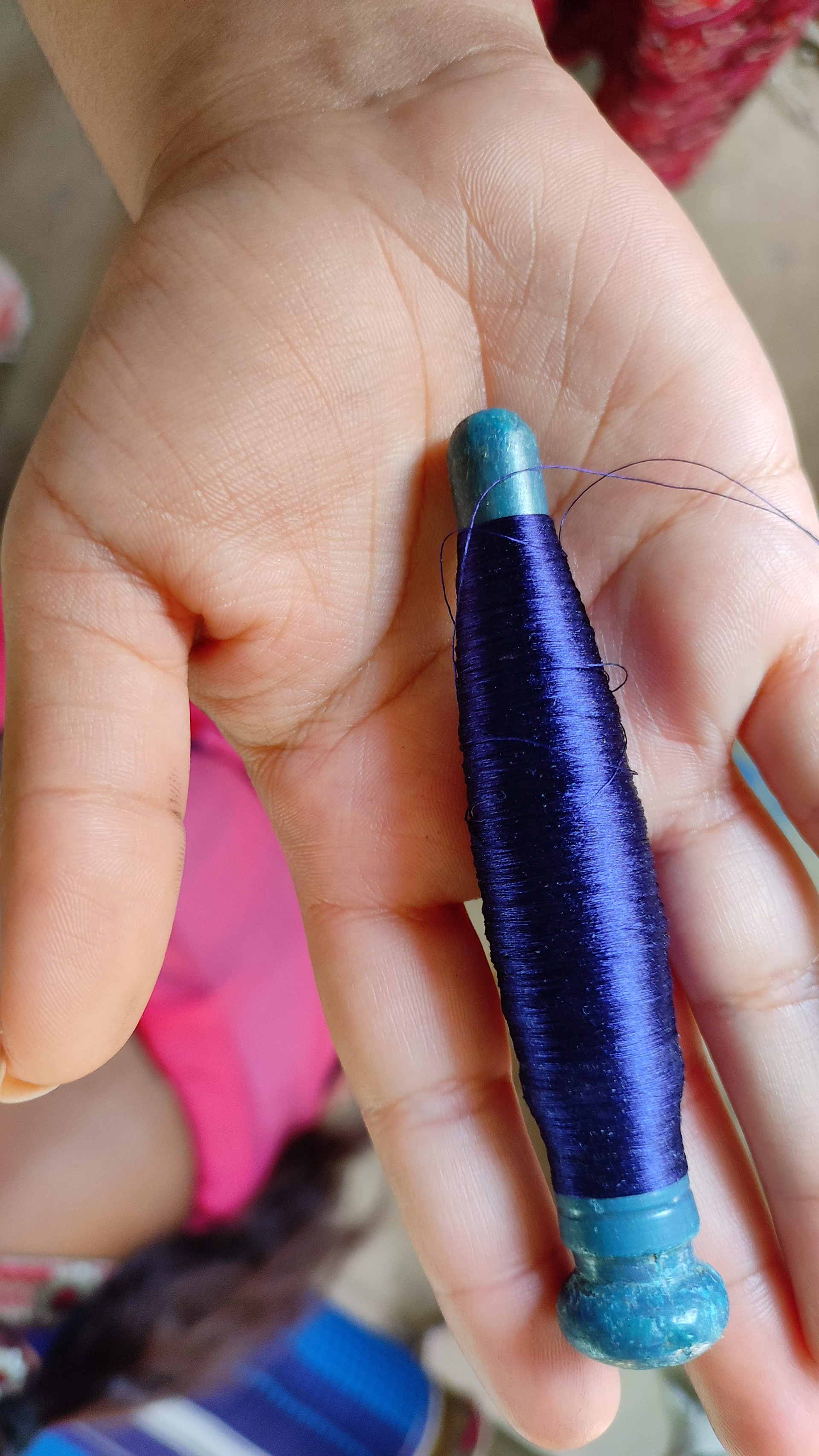 The unsung hero of handloom weaving, the humble thread, ready for its transformation.