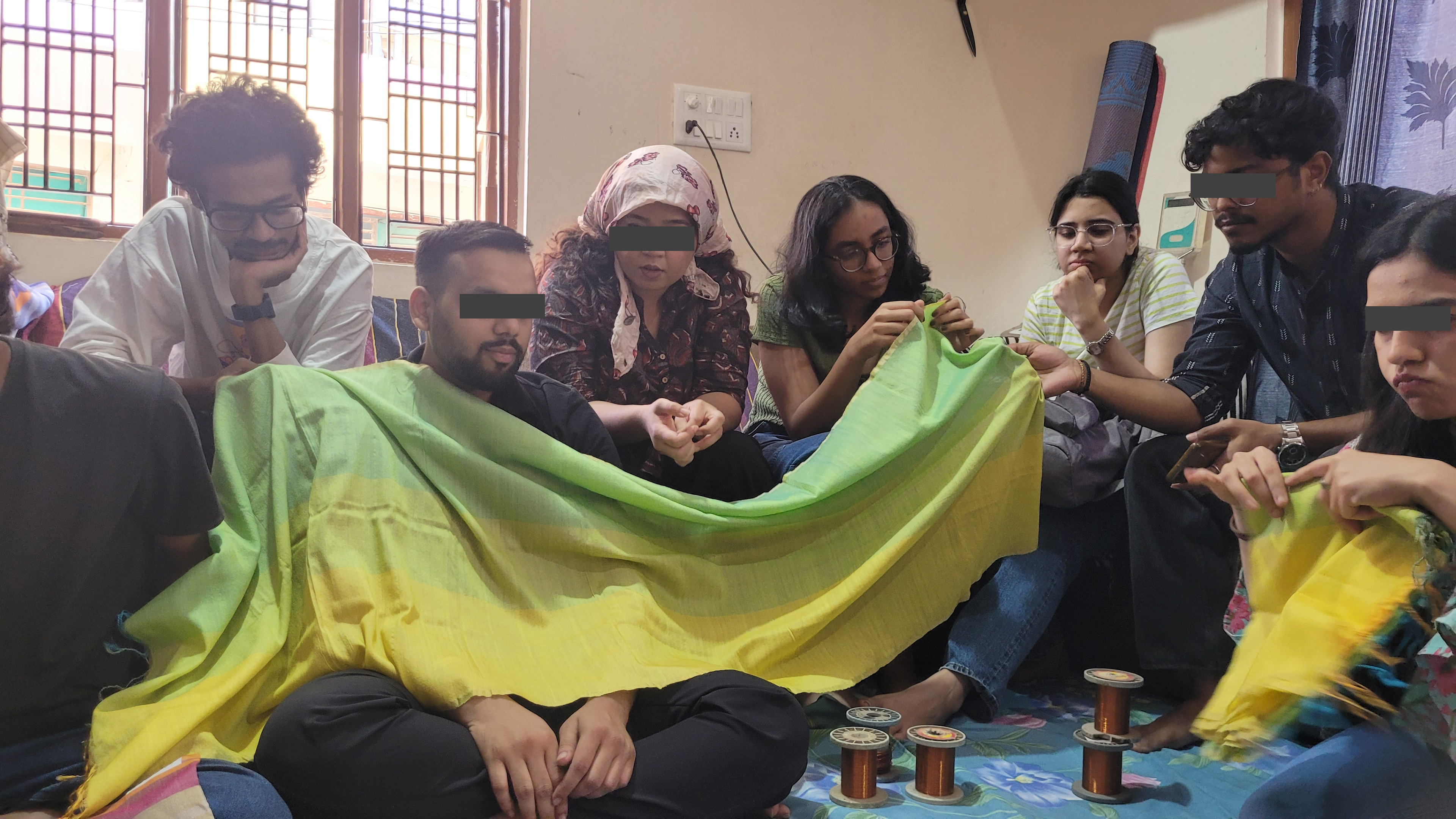 At the house of a Master Weaver, exploring the different weave patterns done for Cotton Silk Sarees.