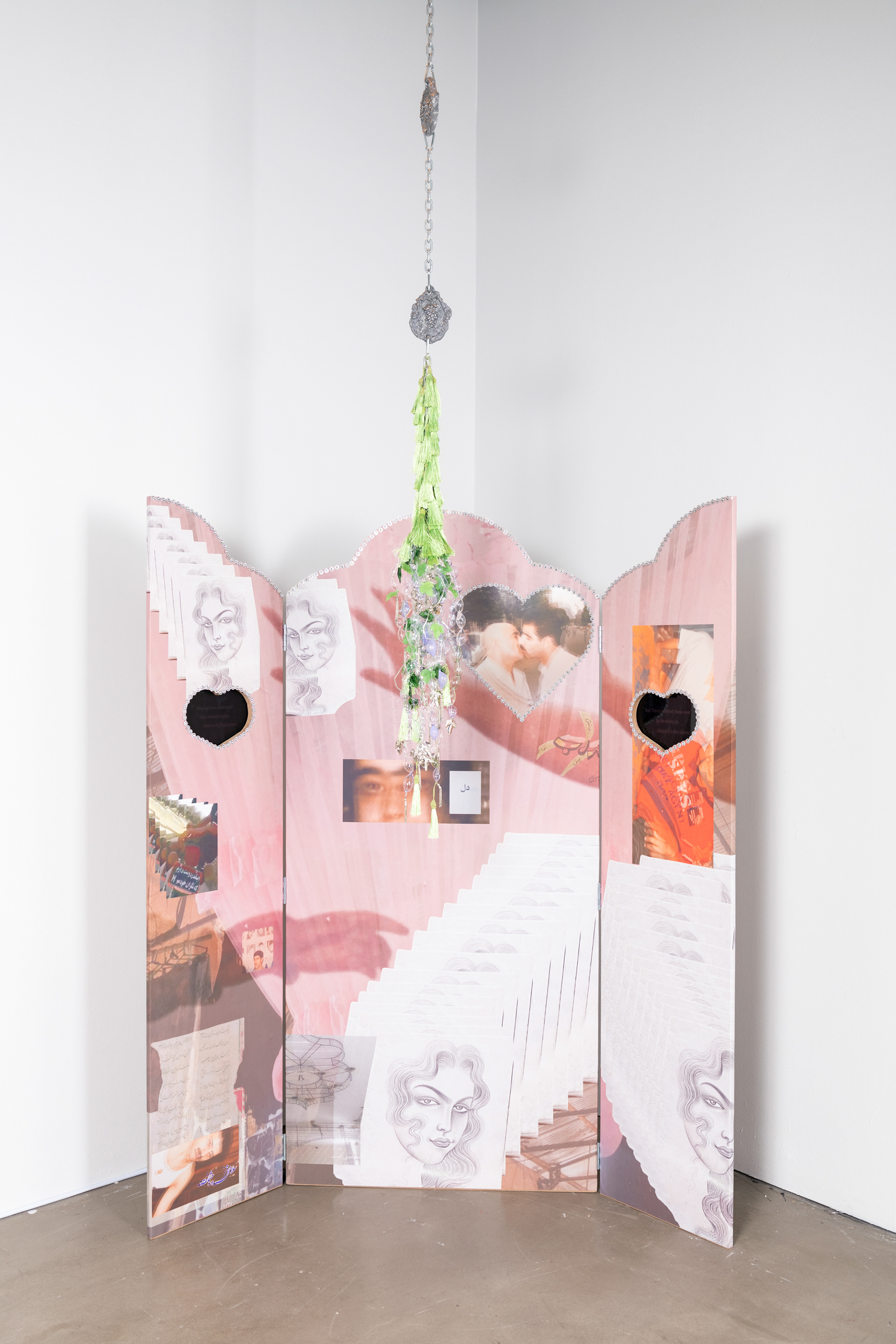 “The World: A World Full of Lies(Dunya Yalan Dunyasi)”, 2024, Installation, Material: CNC MDF, 2 Monitors with looped moving images, Fabricated glass beads, Aluminum Casted Tiles, Chains, Tassels, Pre-fabricated plastic leaves, metal rosary, Bracket, Props grapes.