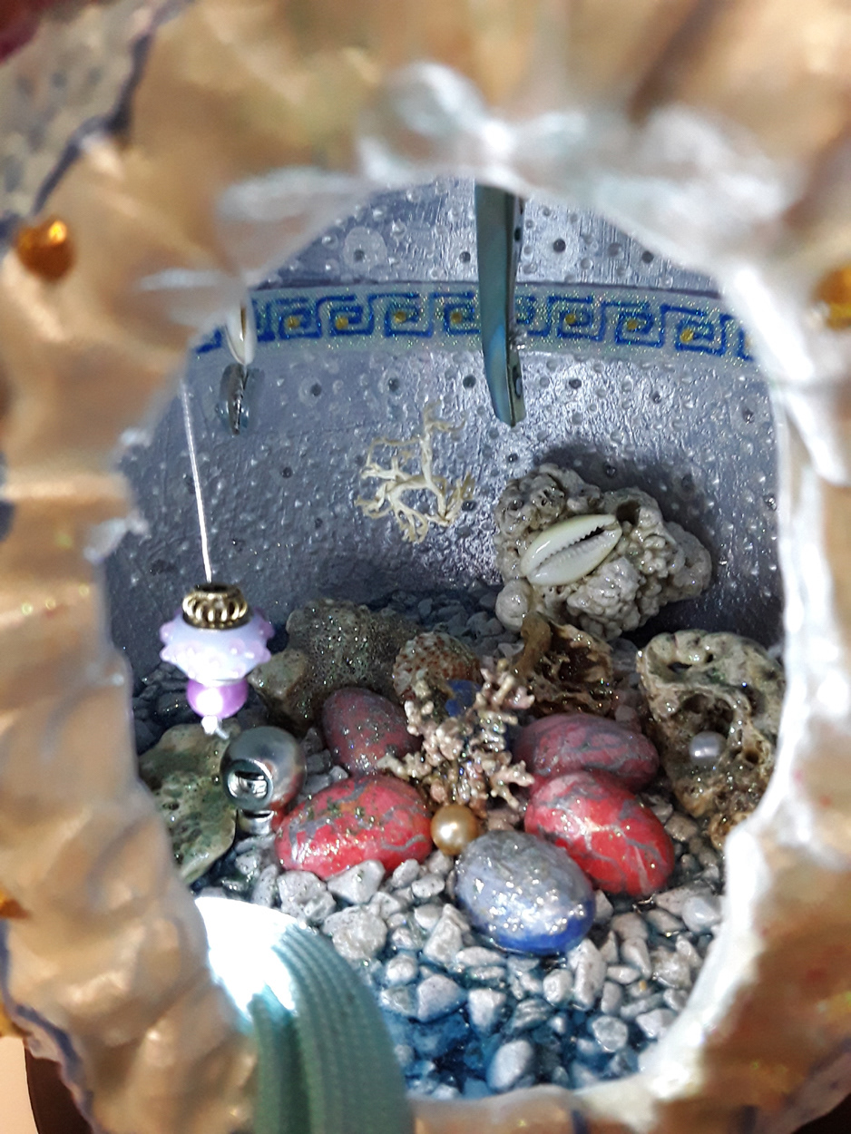 Inside painted eggs, lamp and flotsam treasures