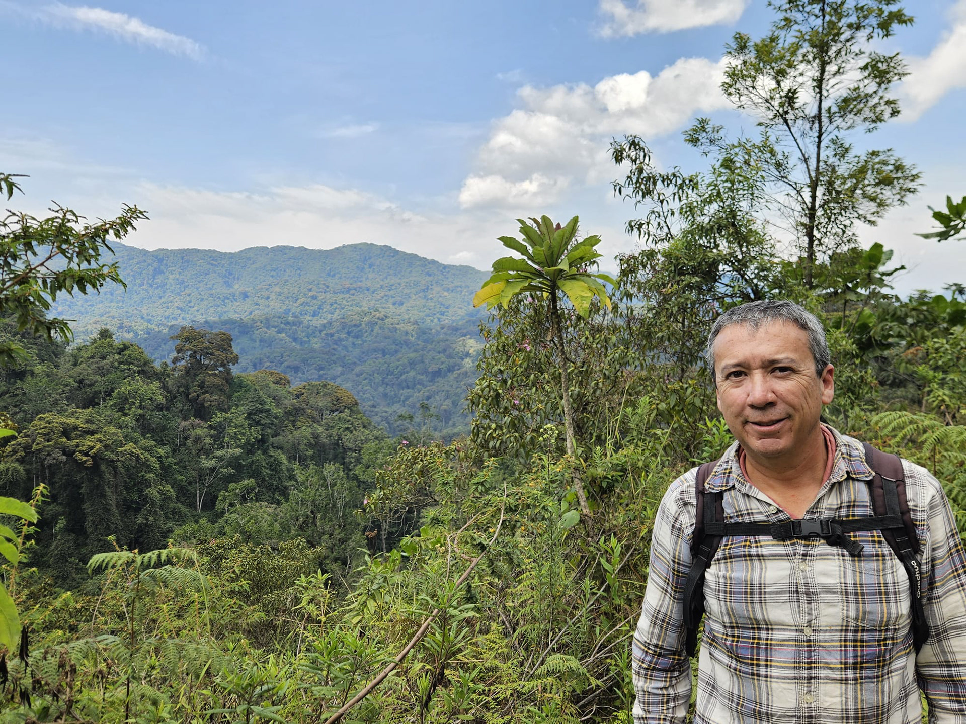 Tourist with mountainous backdrop