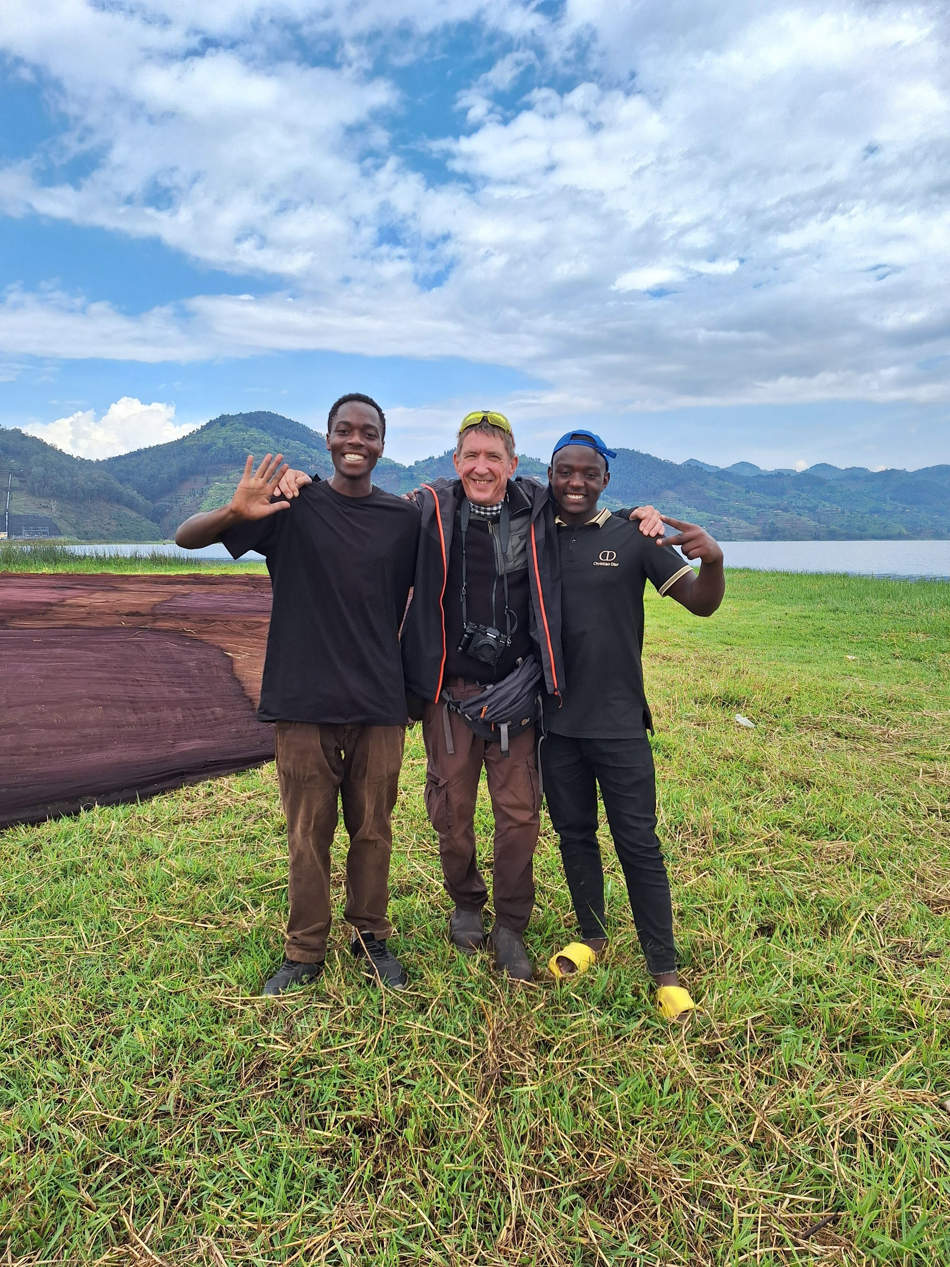 Tourist with local men smiling