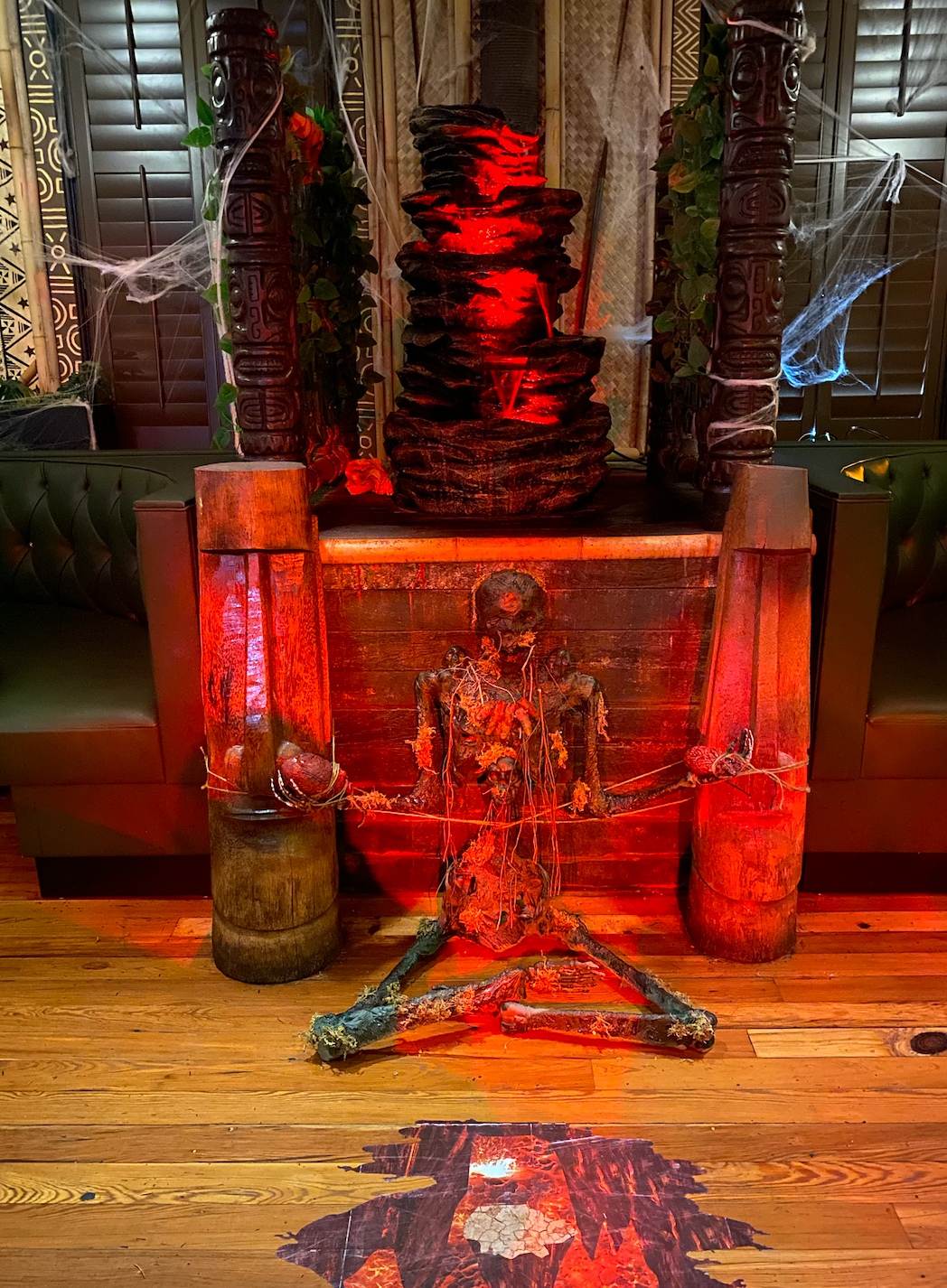 Temple of Doom-style centerpiece! I used orange lava lighting to highlight my prop and red LED lights in the fountain to give the "blood" an extra pop!
