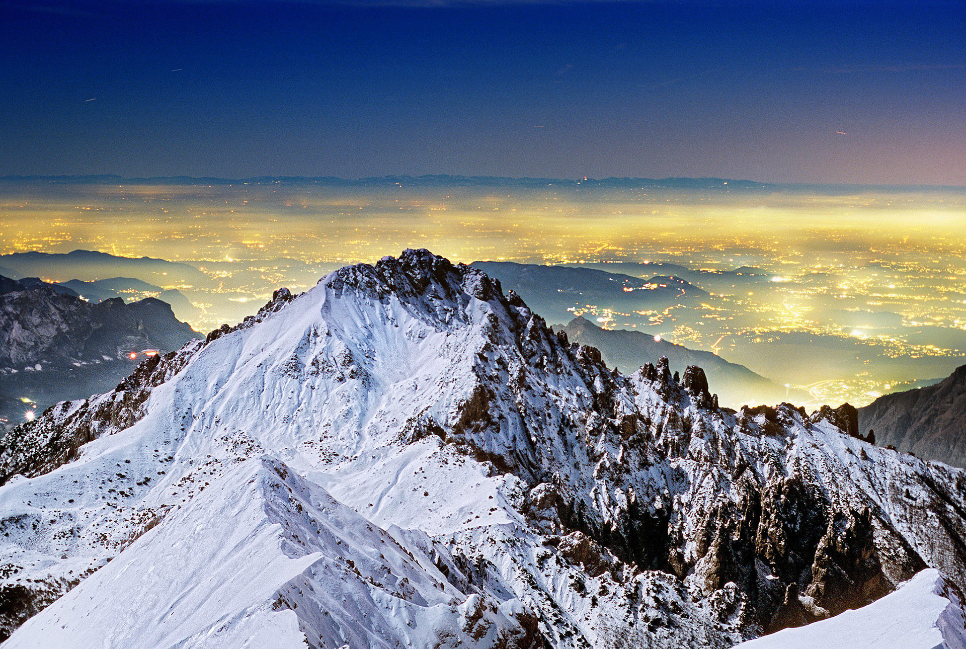 Grigna and Pianura Padana. Lombardy. Italy  -  La Grigna Meridionale (Grignetta) e le luci della pianura padana (Brianza) viste dalla vetta della Grigna Settentrionale (Grignone), Lombardia.