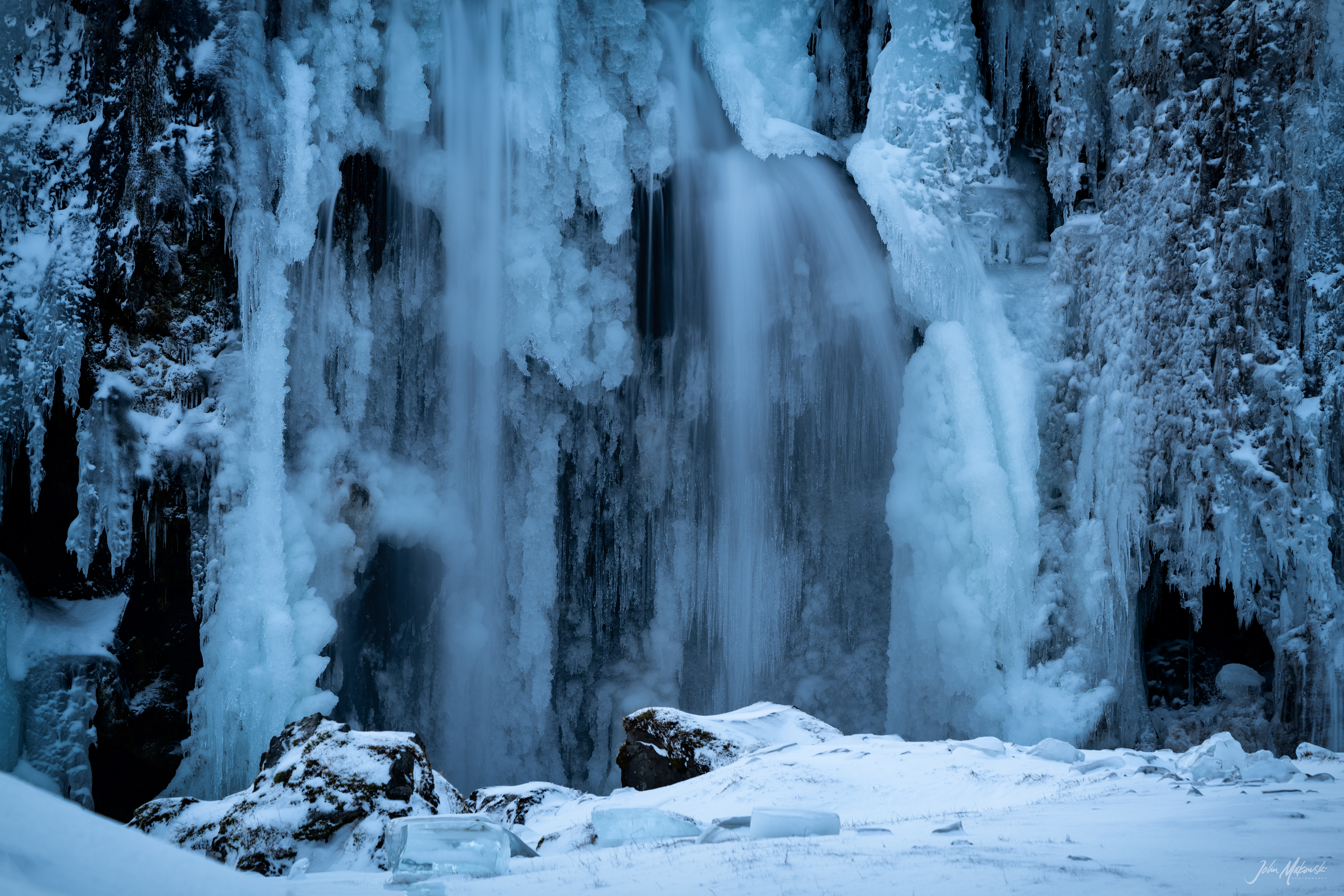Kirkjufellsfoss that channels the glacial water of Snaefellsjokull glacier and Kirkjufell on the Snaefellsnes Peninsula 