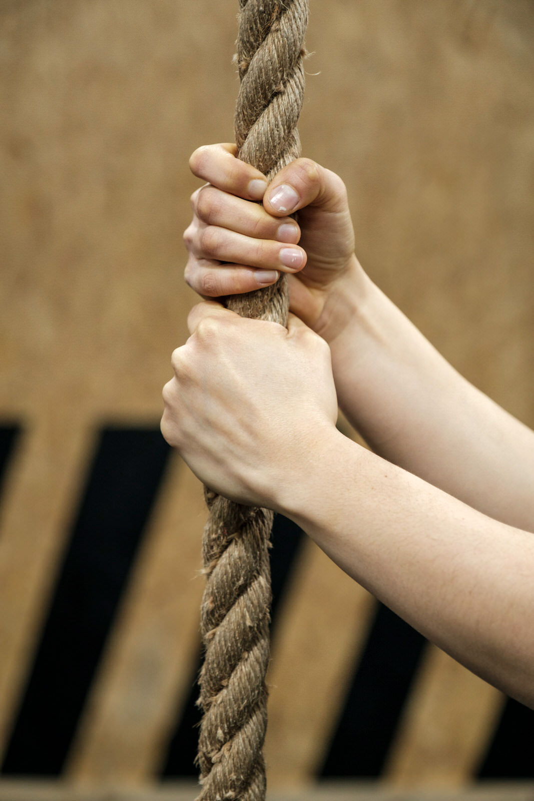 Close-up hands holding a climbing rope