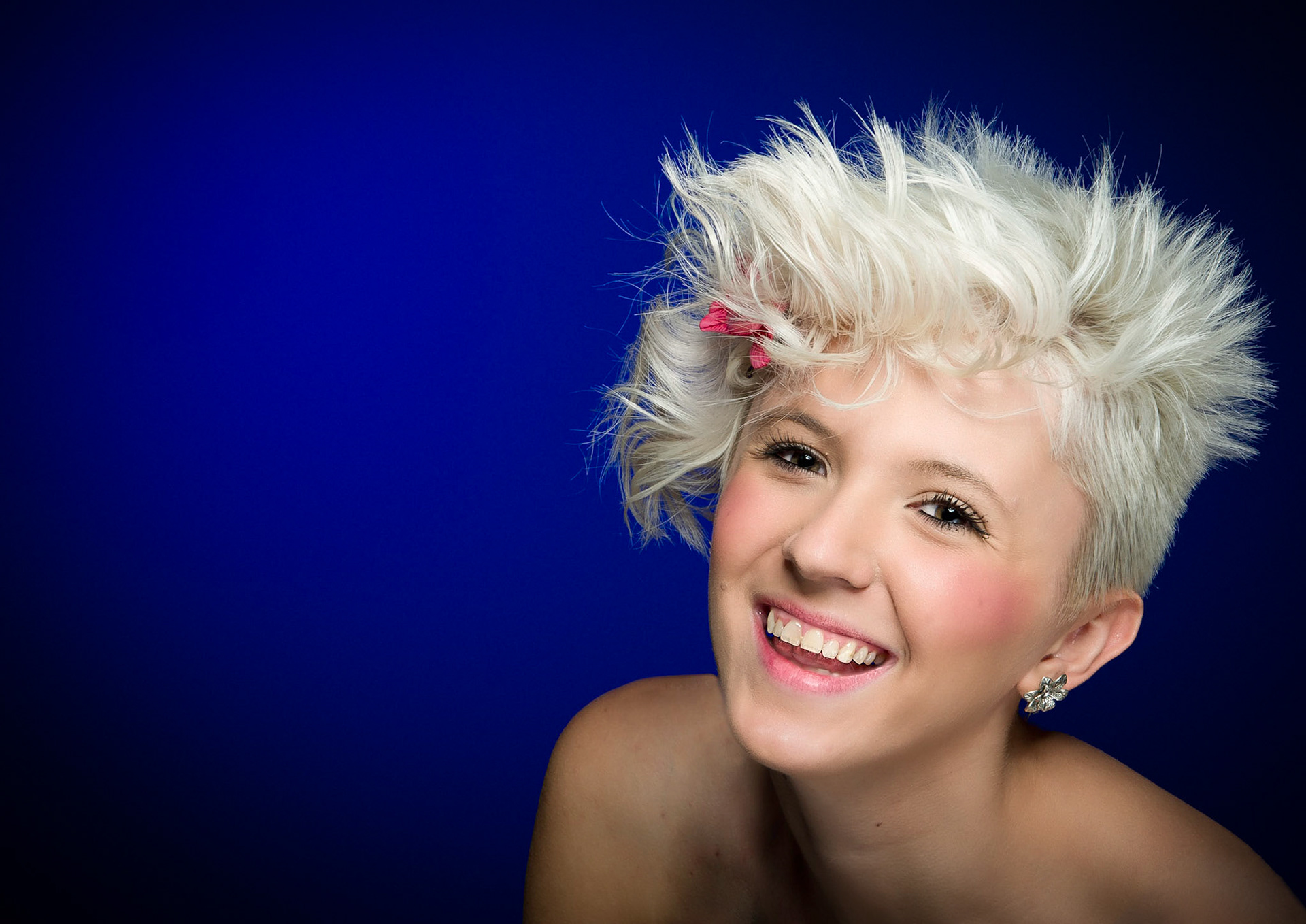 This headshot of Bryony was shot against a plain background lit with a blue gel.