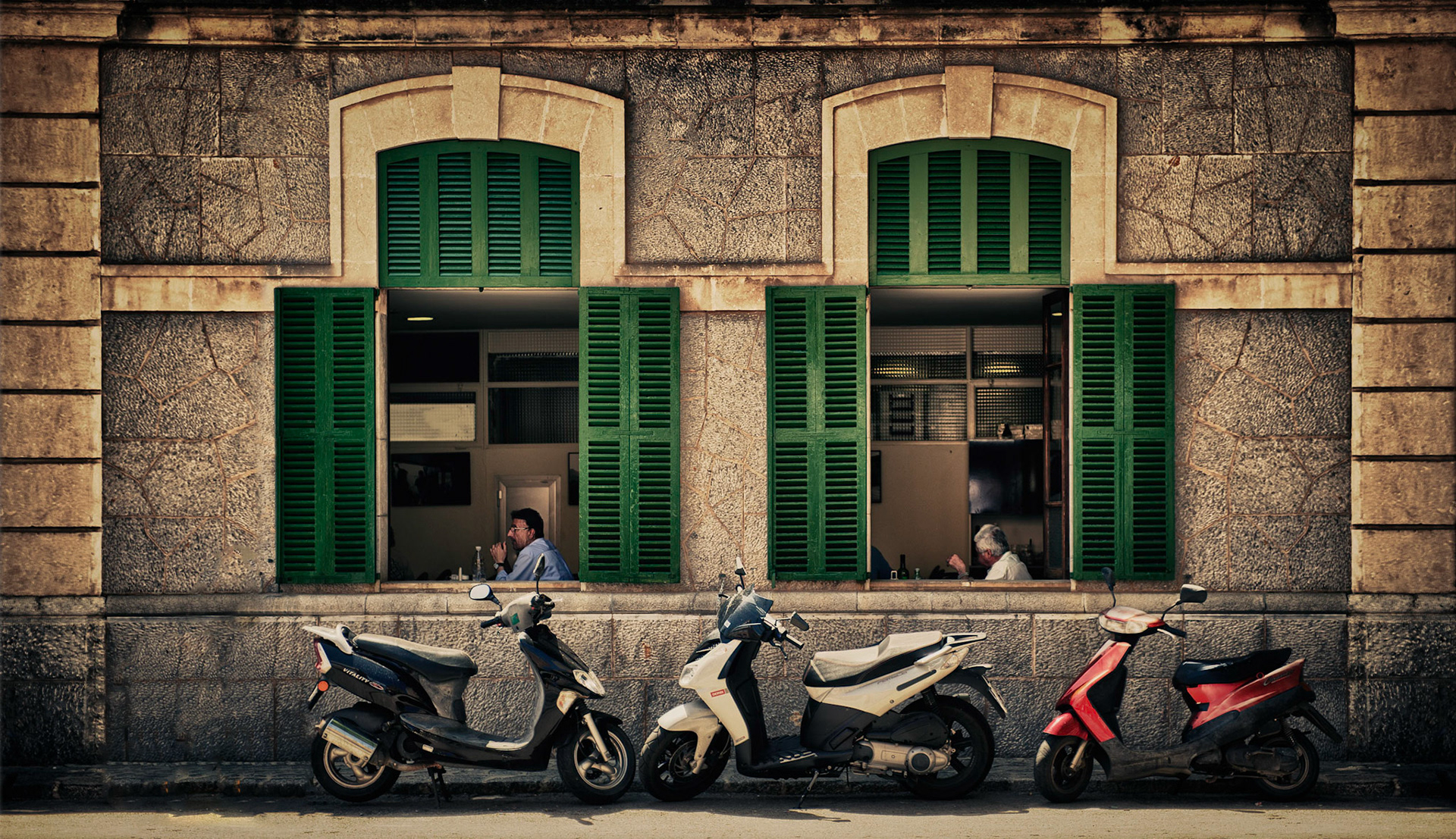 While waiting for my wife outside a gift shop this scene caught my eye across the street and it was quick grab shot between traffic. The scene is an HDR which needed a little clutter cloning out to get the final result.