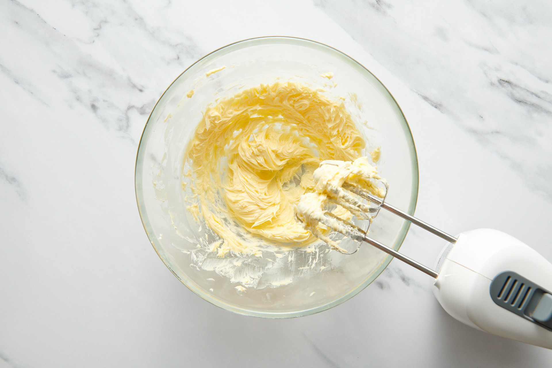 Step-by-step recipe photography showing active mixing in a bowl