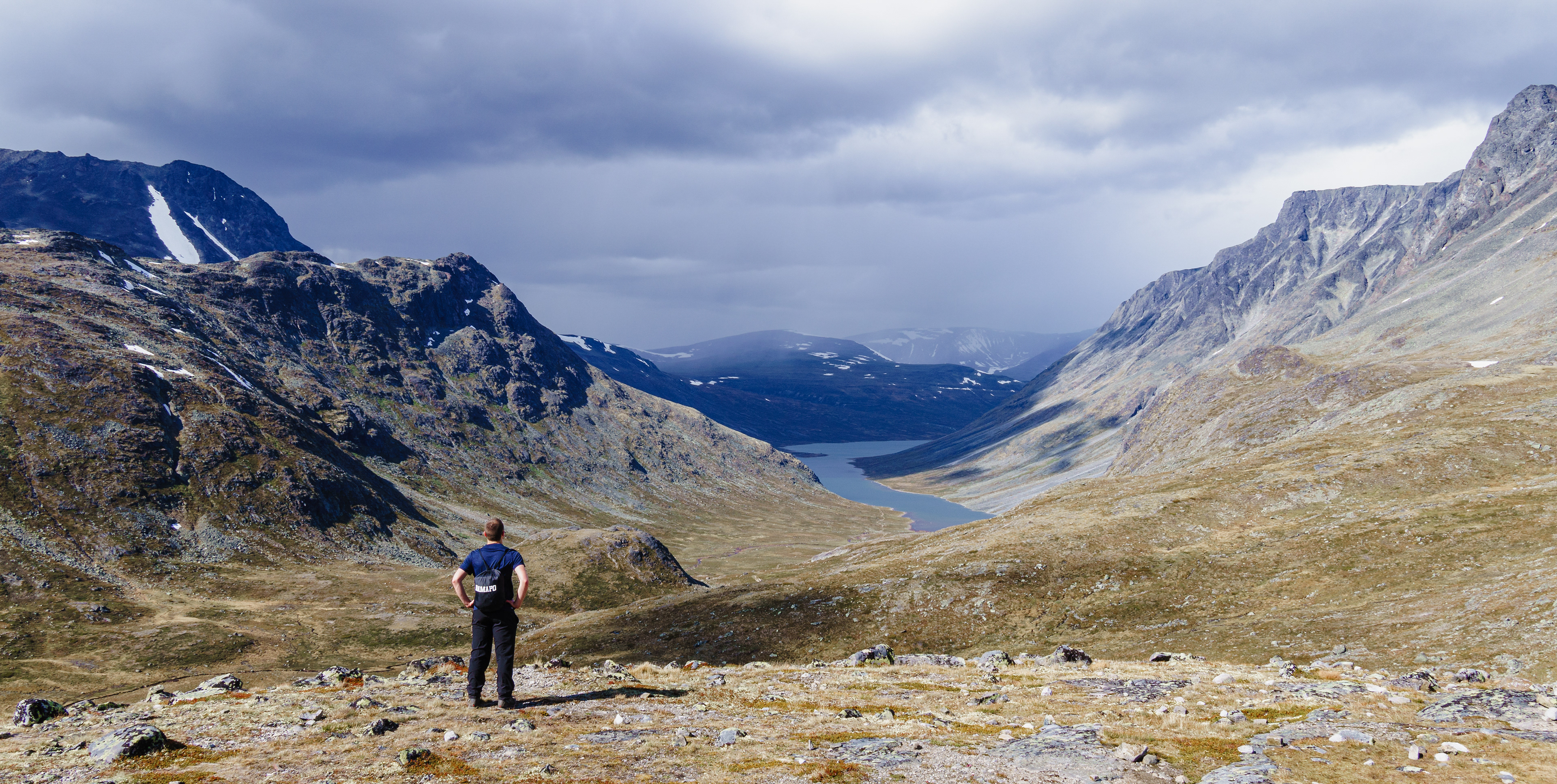 Nick beholding the vast, rugged Norwegian landscape along the Besseggen Ridge Trail in Jotunheimen Nasjonalpark