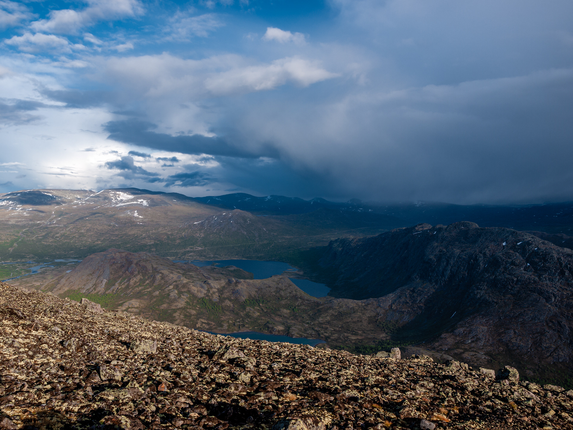 Massive clouds ominously following along the Besseggen Ridge Trail