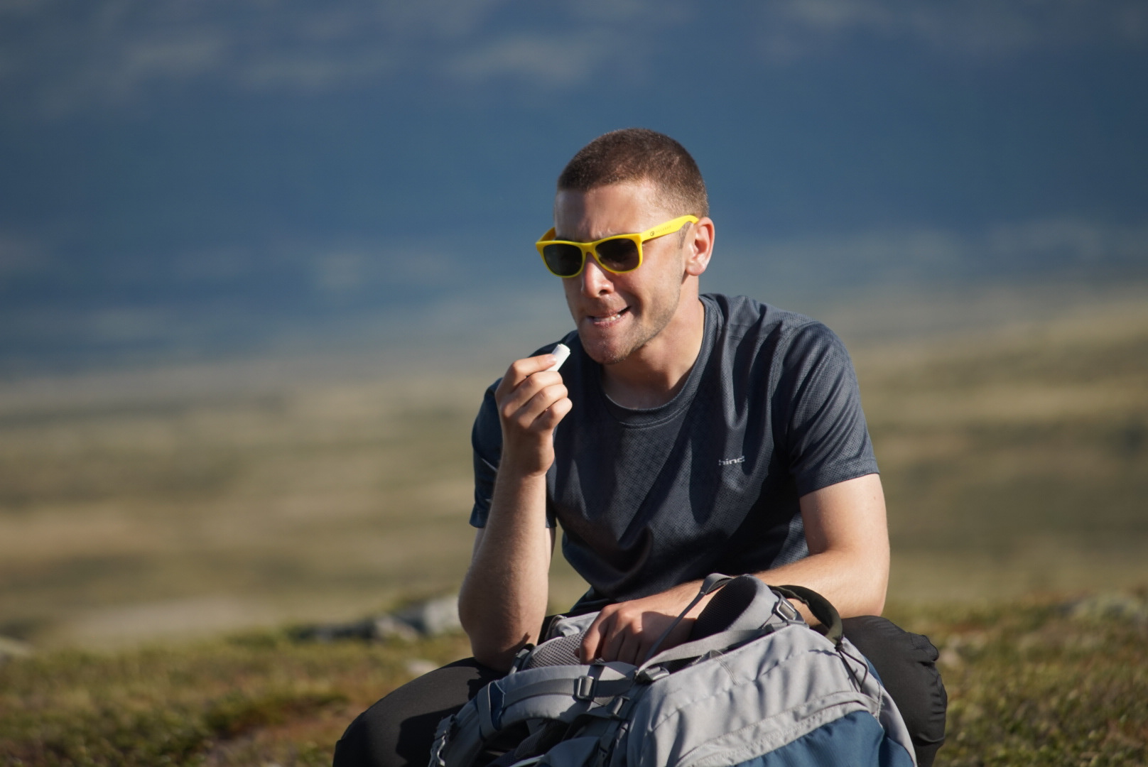 Nick attempts to use lip balm on his extremely chapped and burnt lips