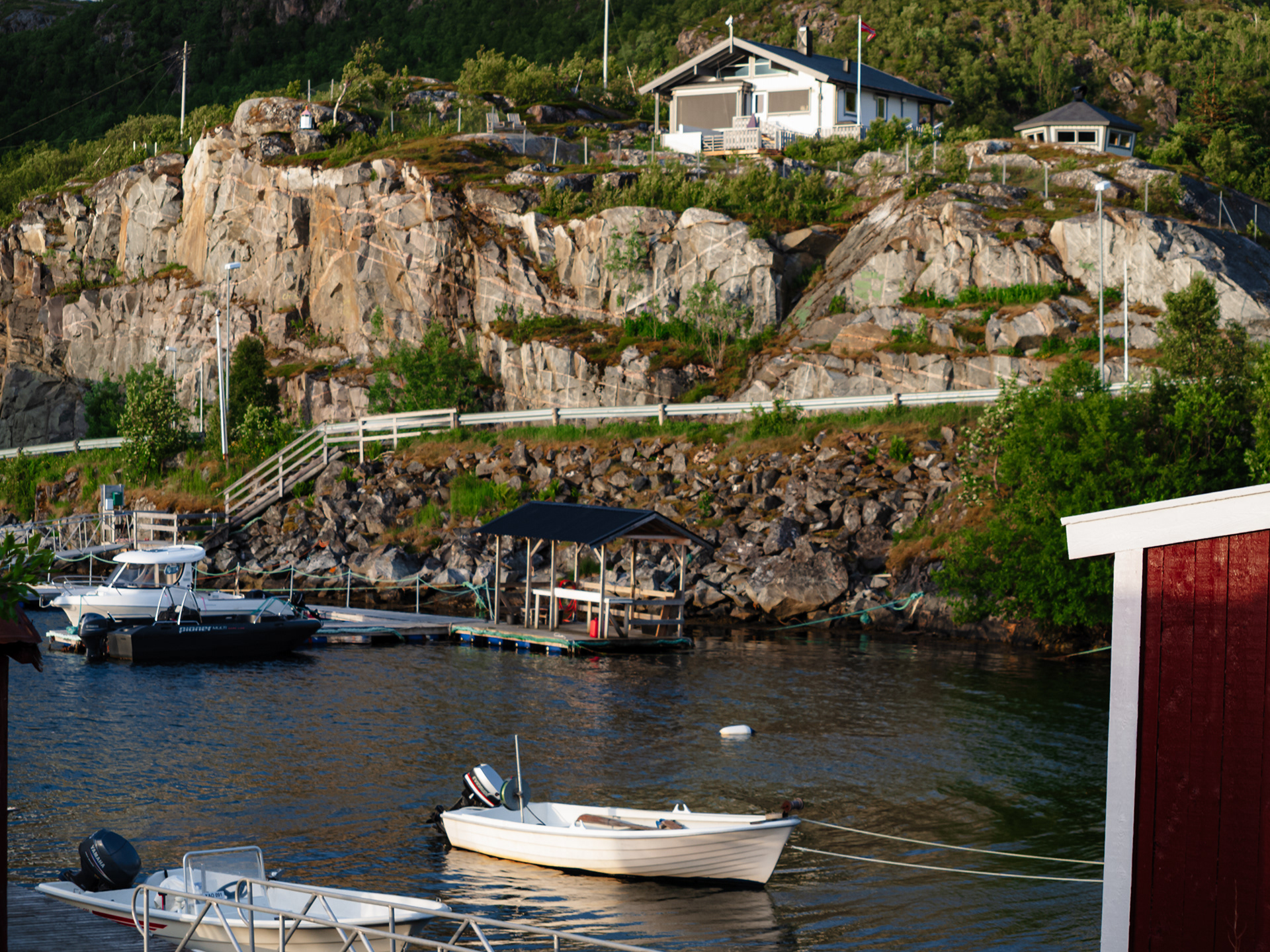 Small boats tied up at a dock in Skrolsvik