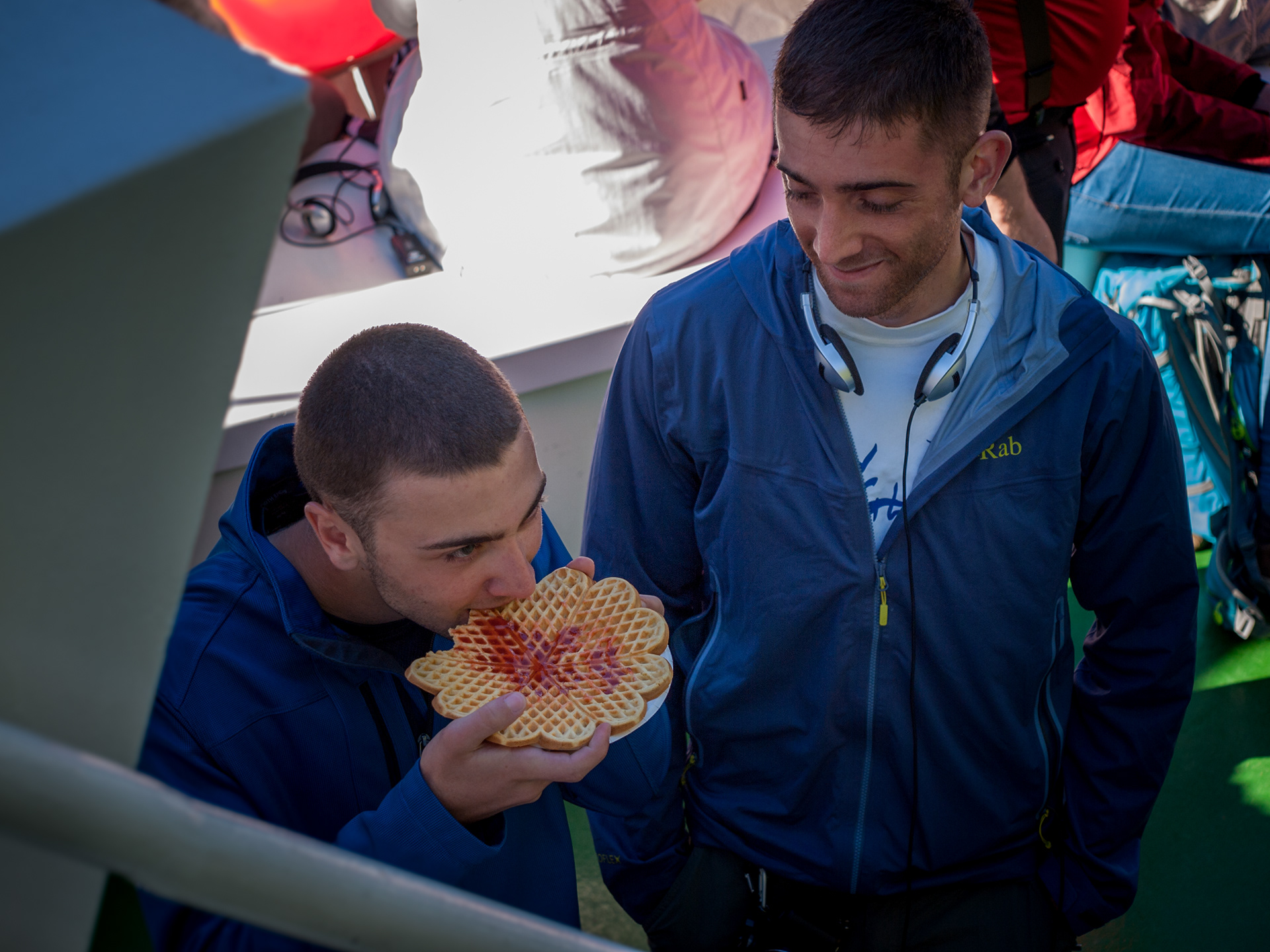 Nick enjoys a freshly made waffle with jam on a ferry cruise in Geirangerfjord